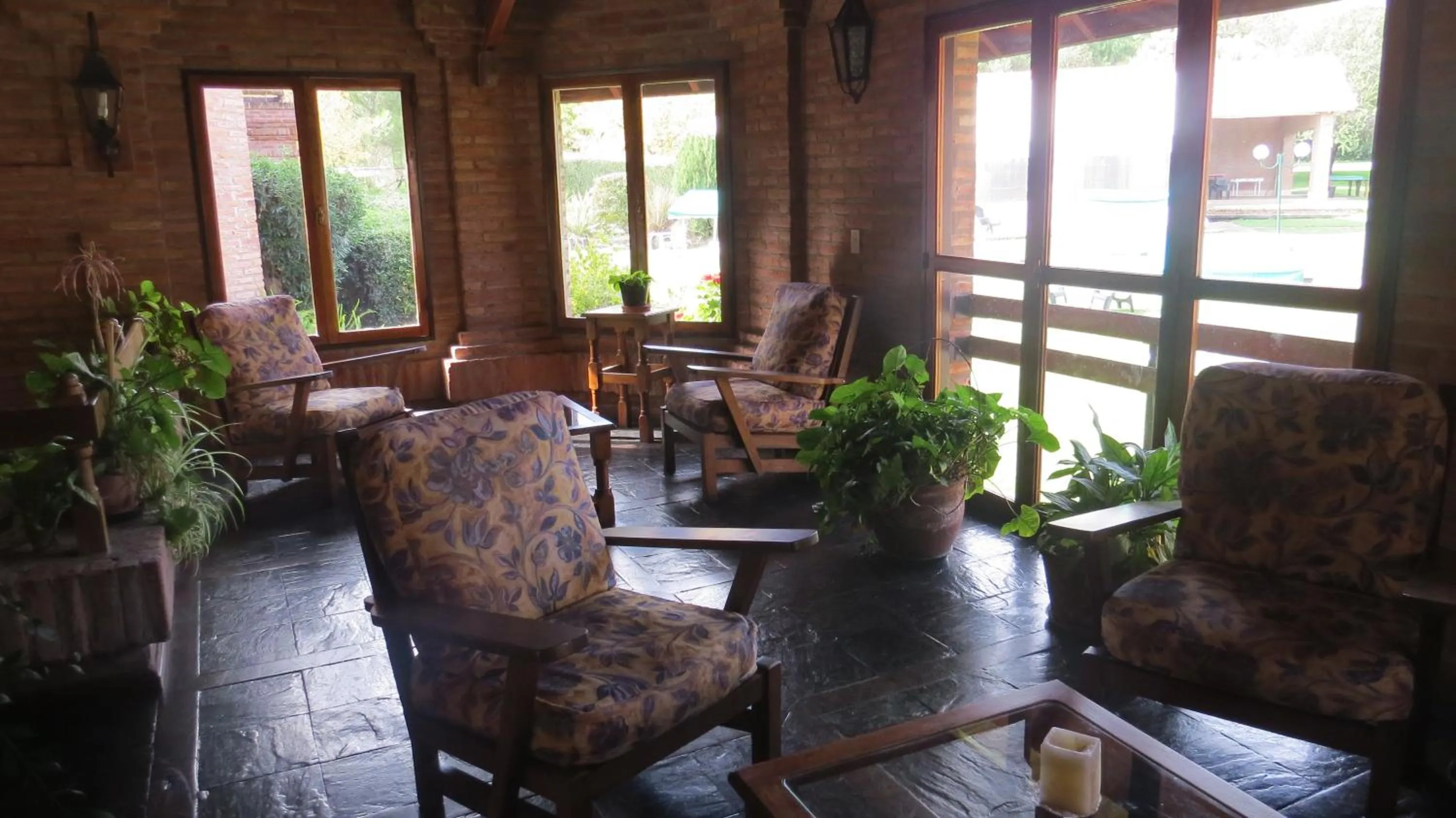 Communal lounge/ TV room in Villa de Merlo All Inclusive & Spa by MH