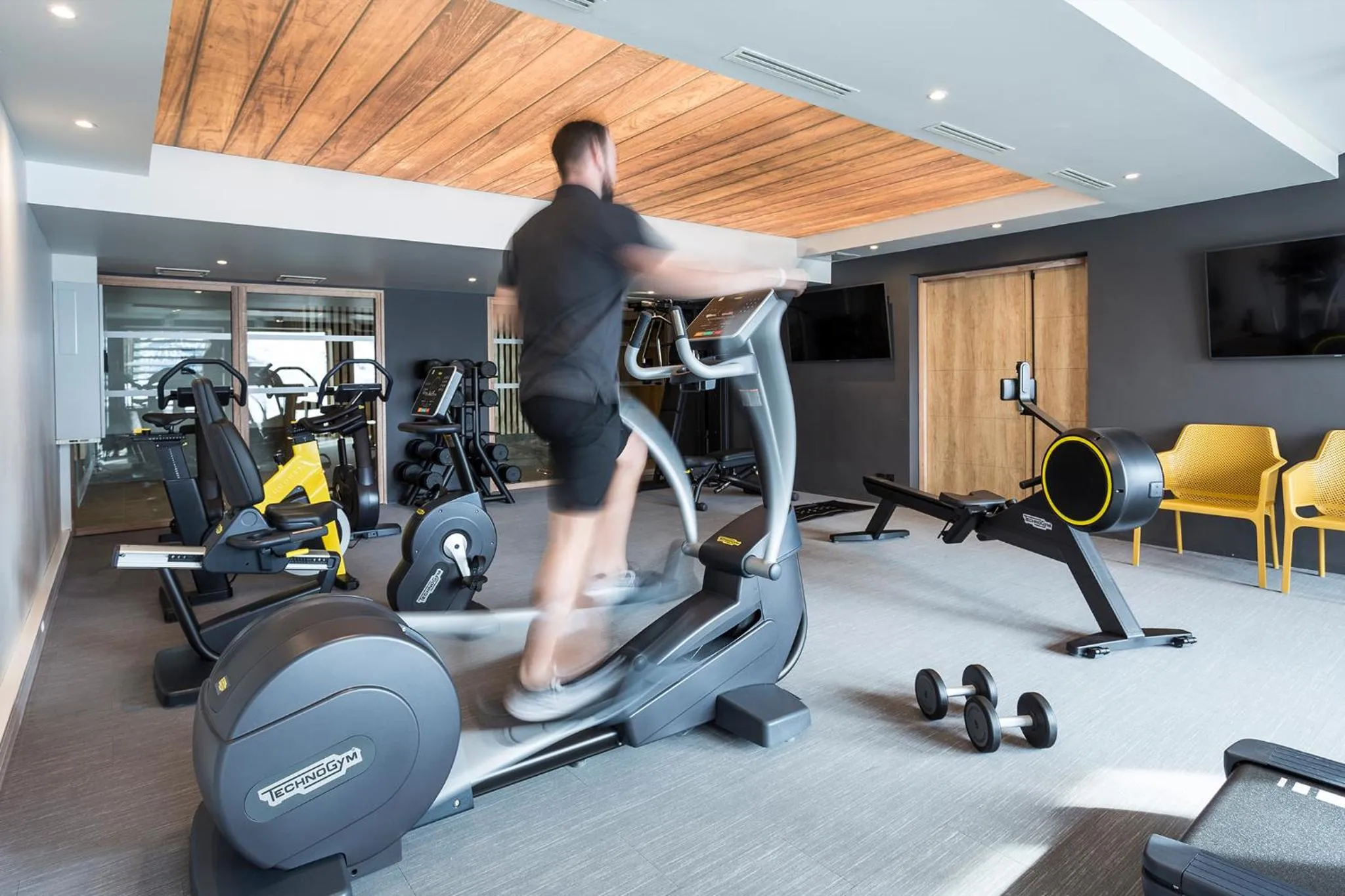 Fitness centre/facilities in Hôtel Alparena & Spa - 4 étoiles