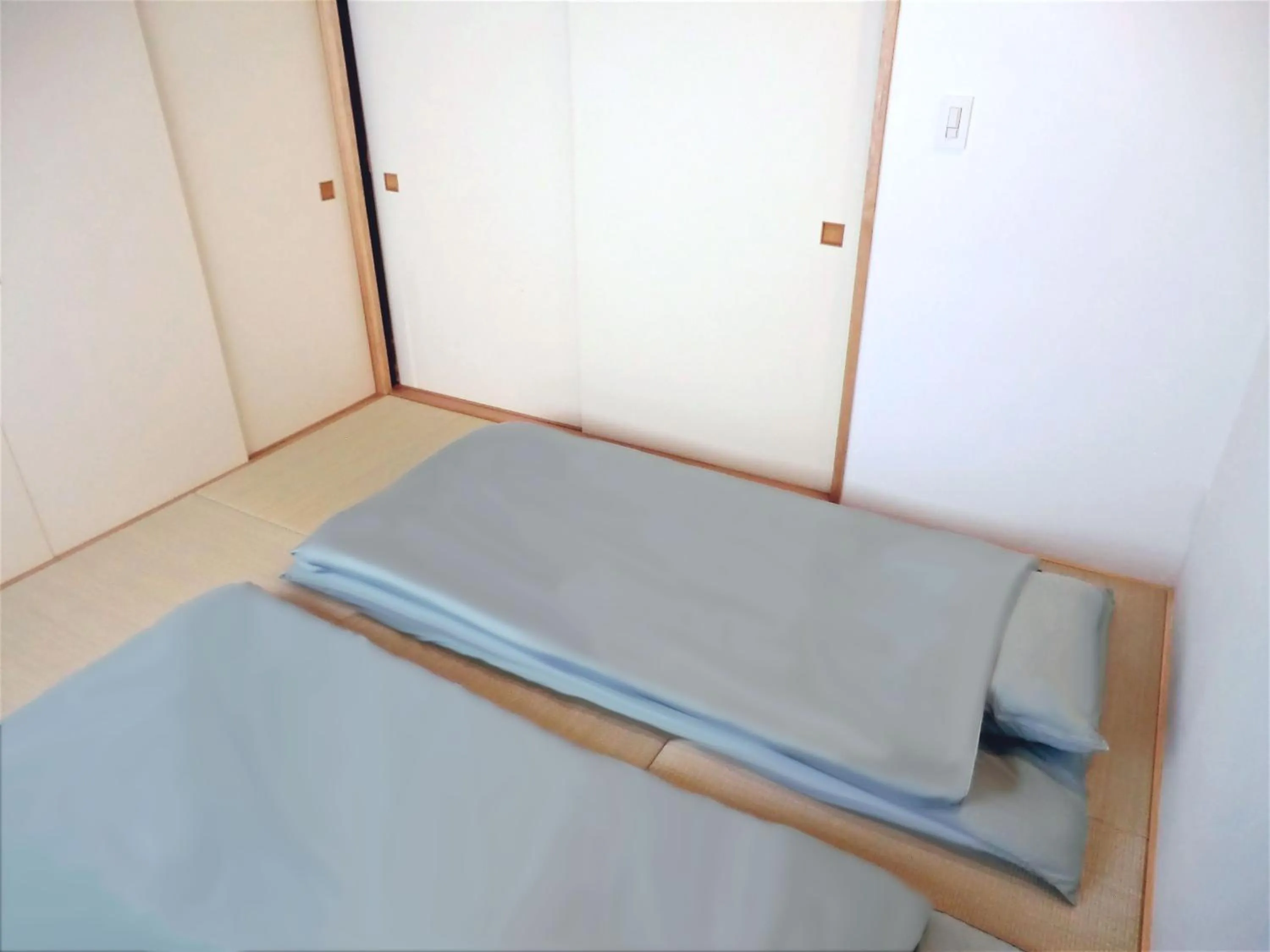 Bed in Machiya Hotel YANAGI