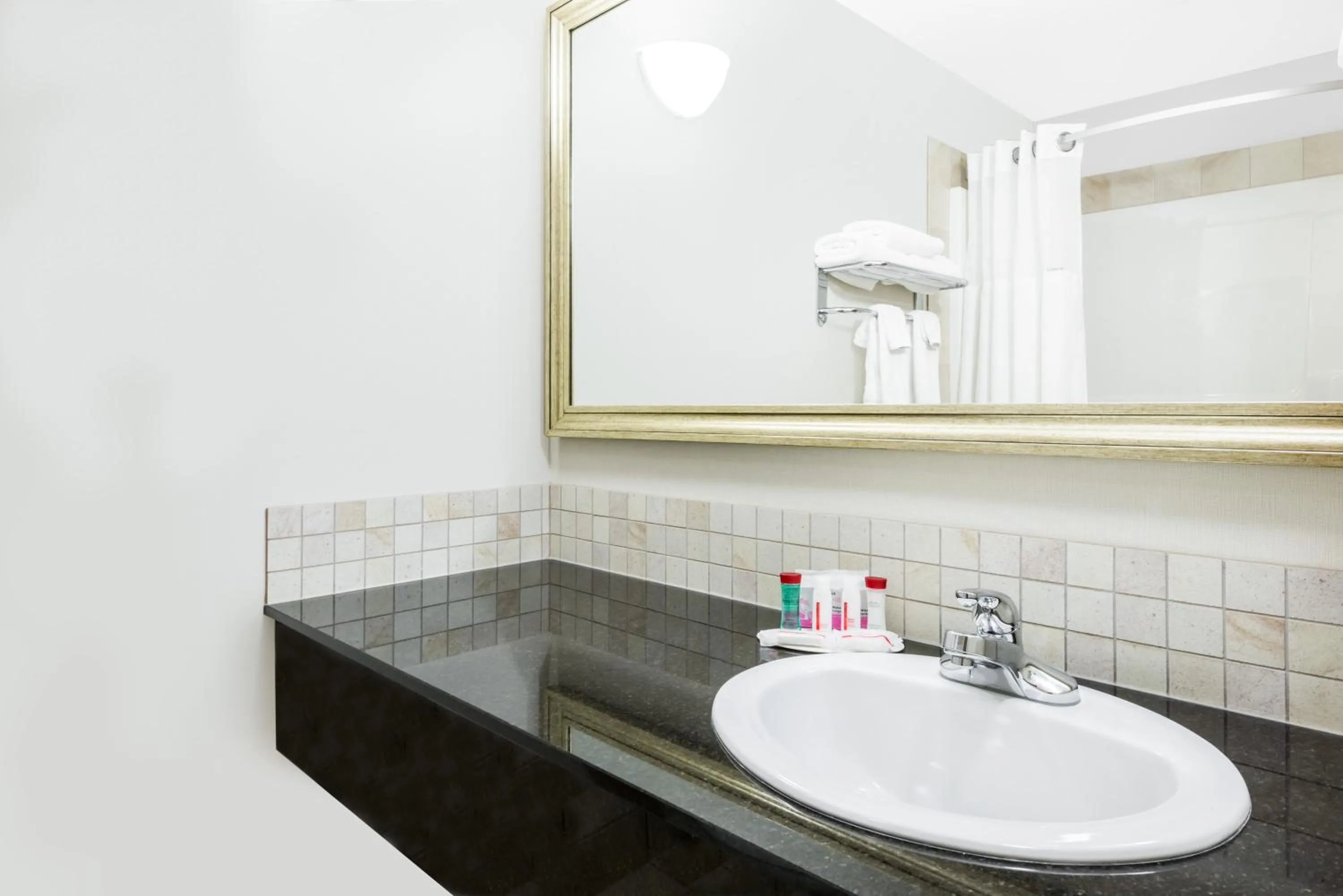 Bathroom in Ramada by Wyndham Olds