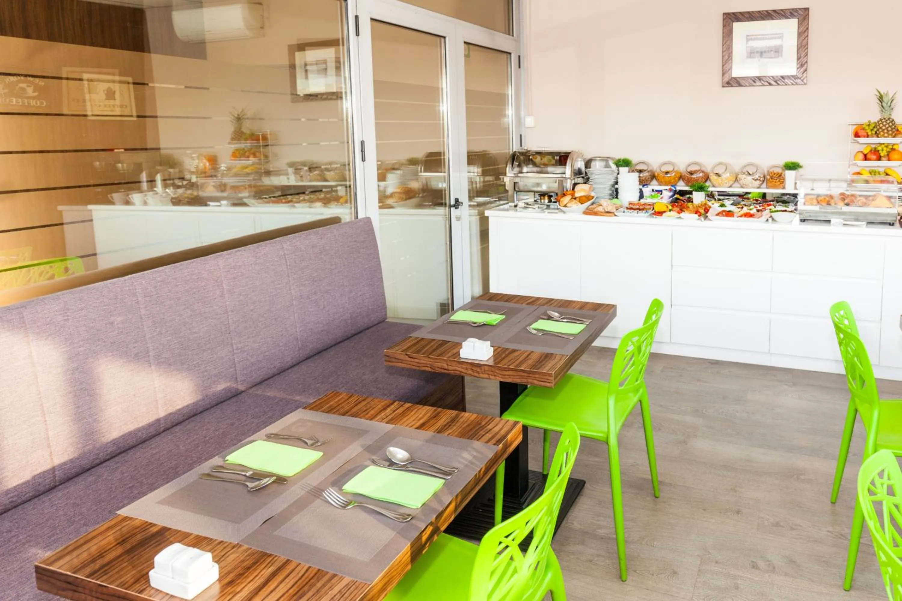 Communal lounge/ TV room in Adresa Suites