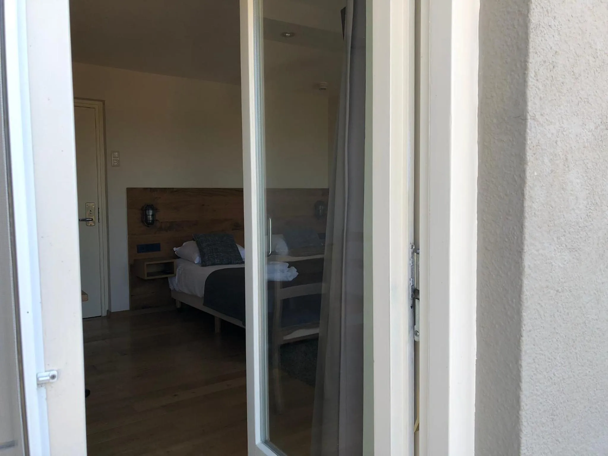 Balcony/Terrace, Bed in Hotel de Plank - alle kamers met airconditioning