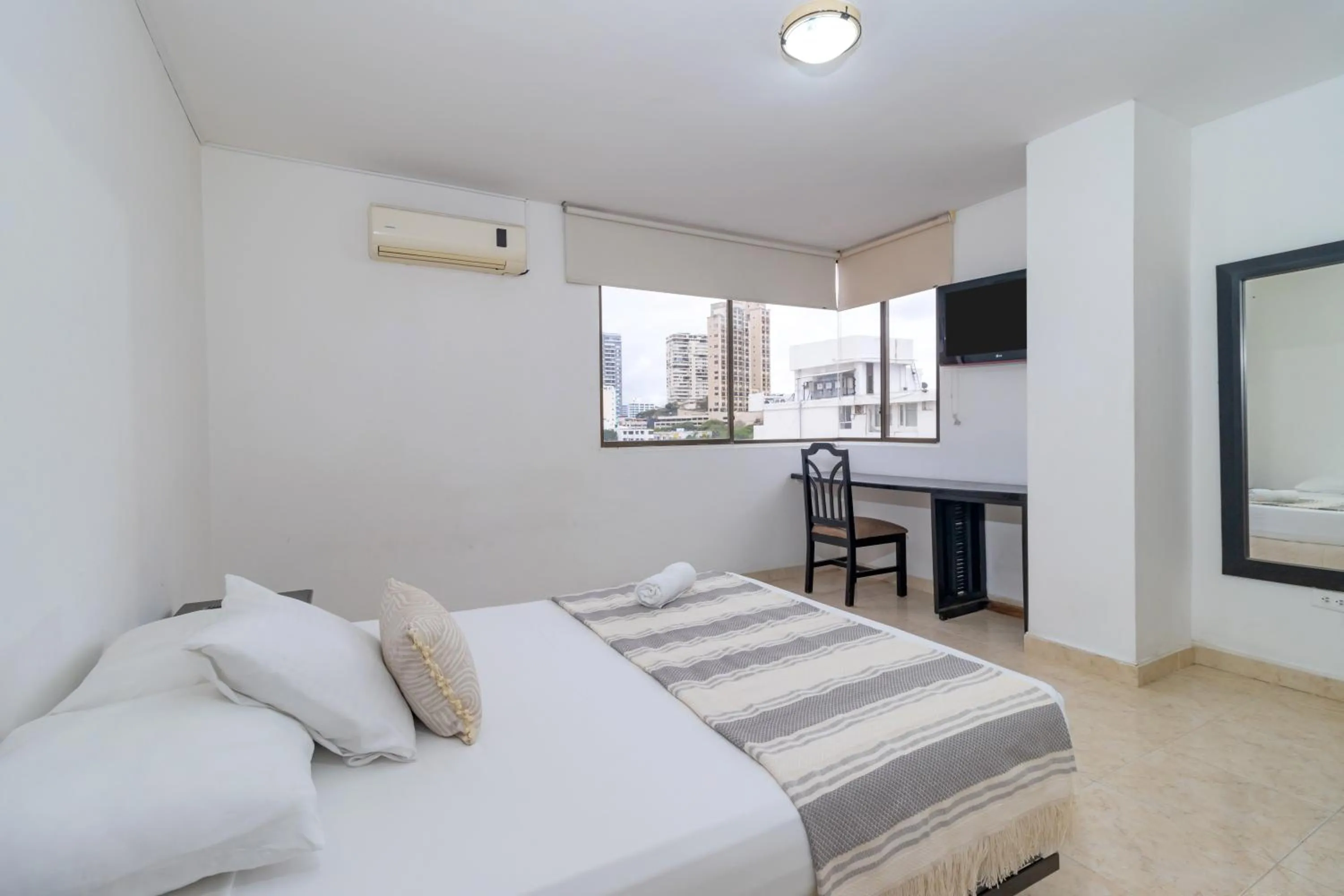 Bed in Hotel Axis Inn By GEH Suites