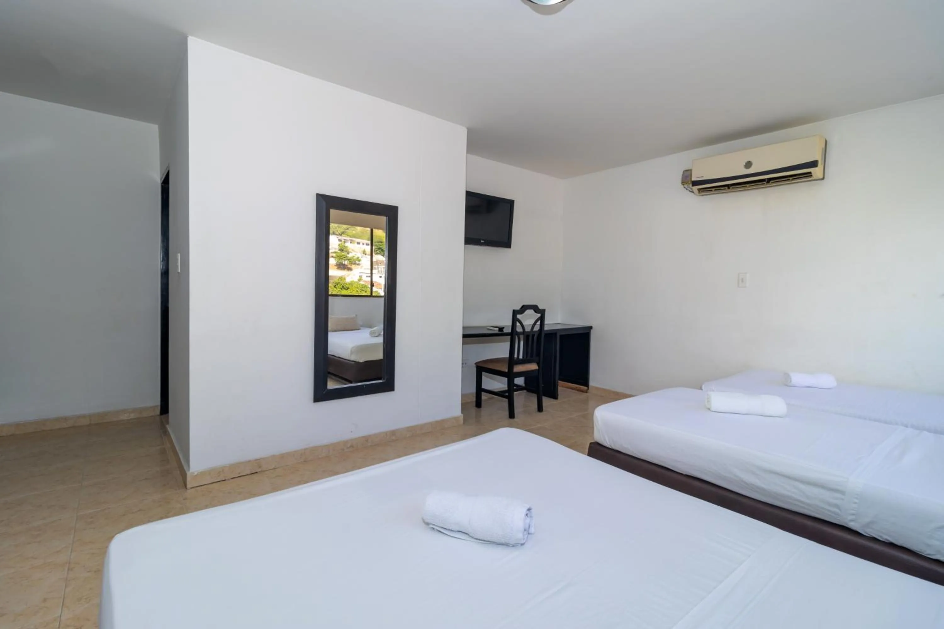 Bed in Hotel Axis Inn By GEH Suites