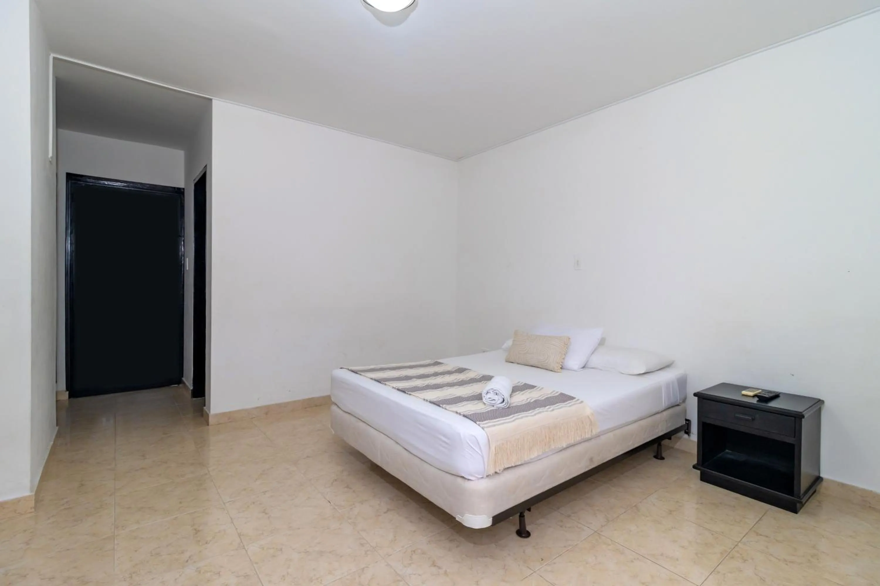 Bed in Hotel Axis Inn By GEH Suites