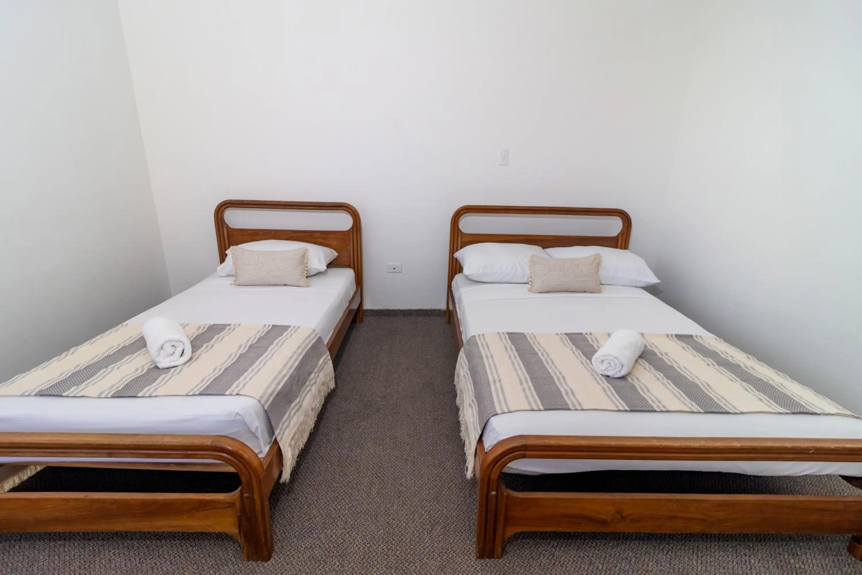 Bed in Hotel Axis Inn By GEH Suites