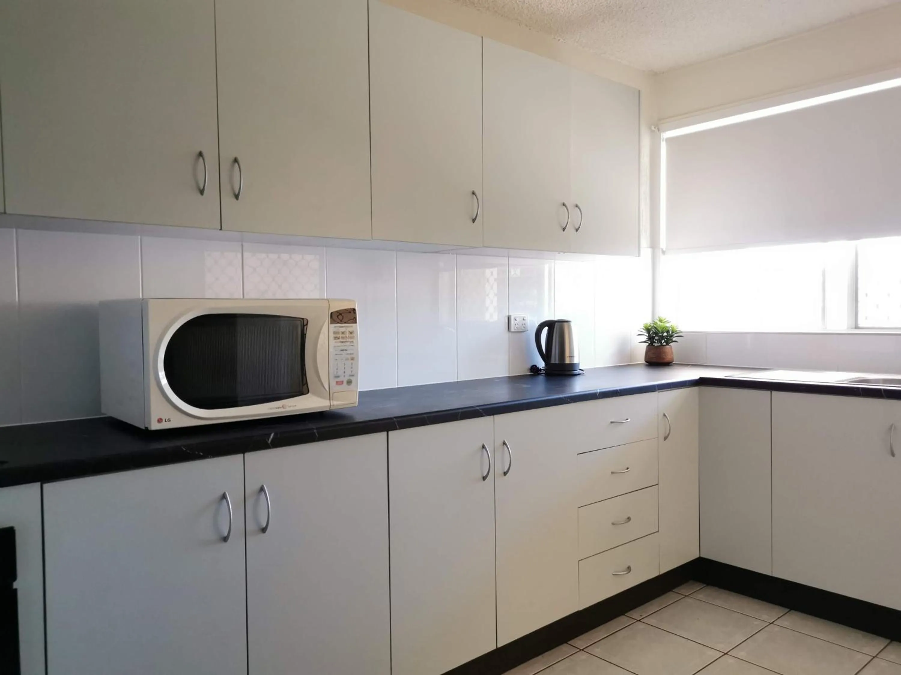 Kitchen or kitchenette in Palm Waters Holiday Villas