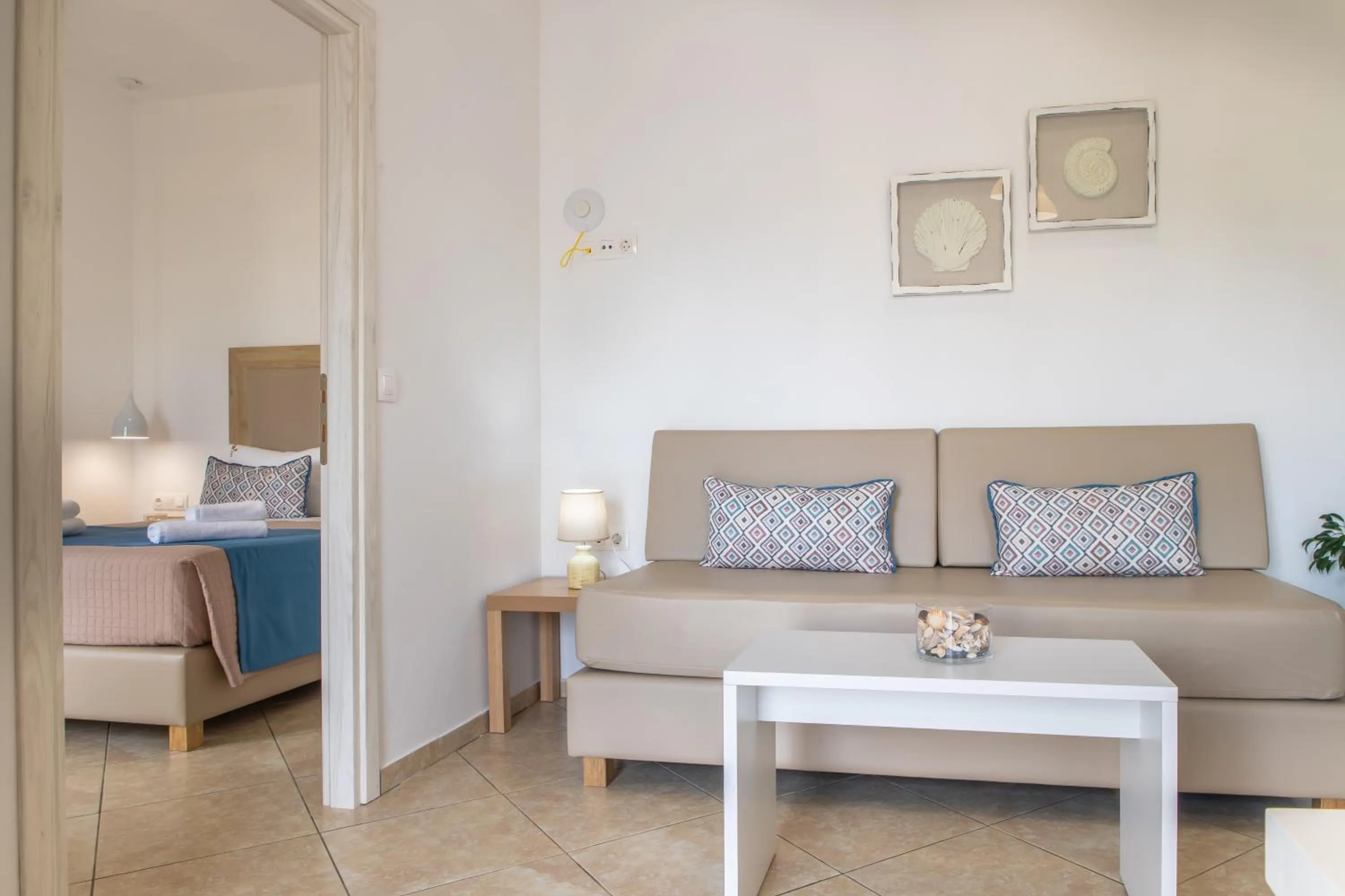 Seating area, Bed in Argiri Apartments & Suites