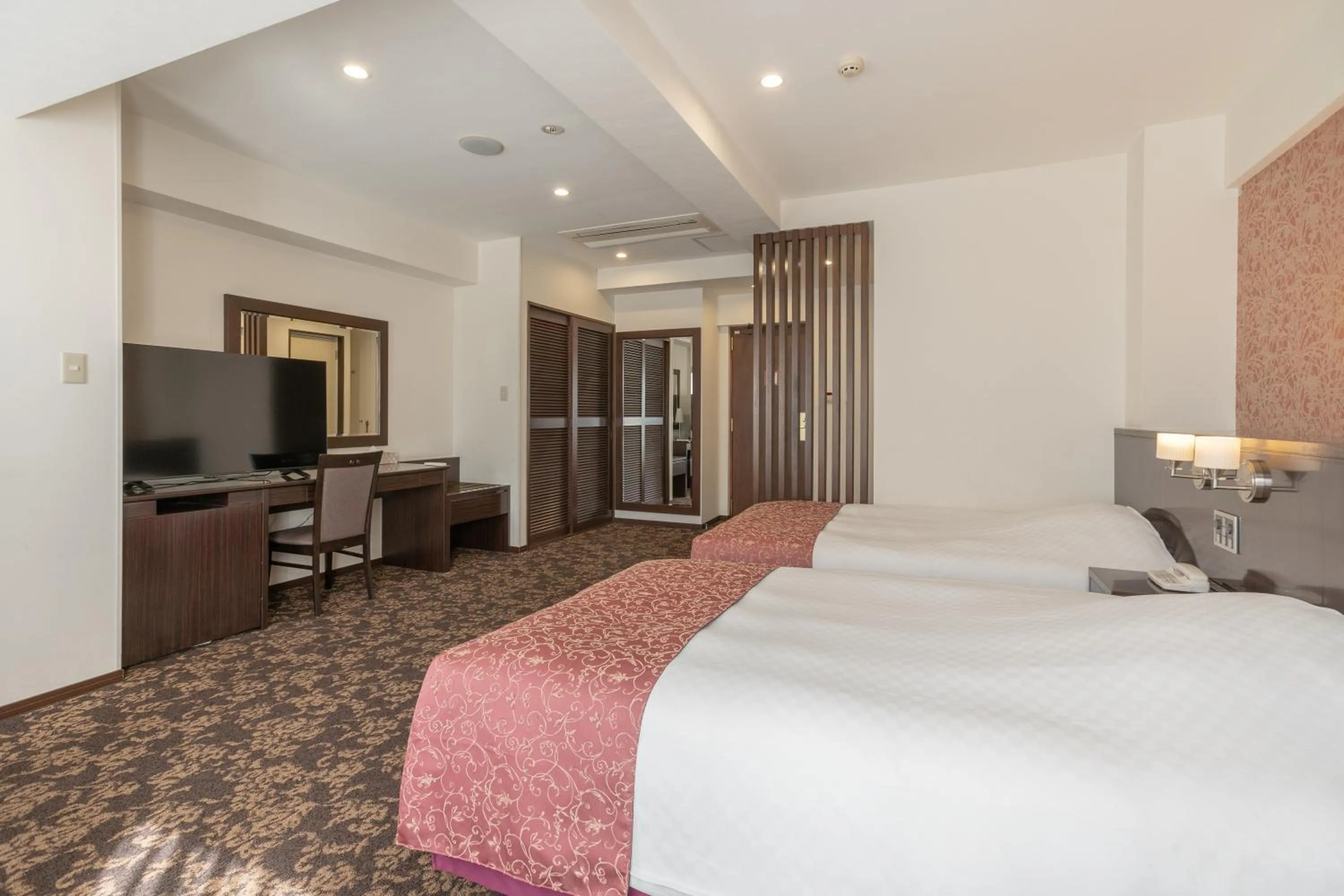 Bed in Libre Garden Hotel