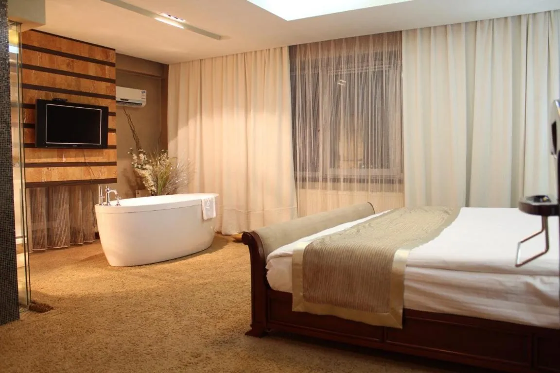 Bed in The Corporate Hotel