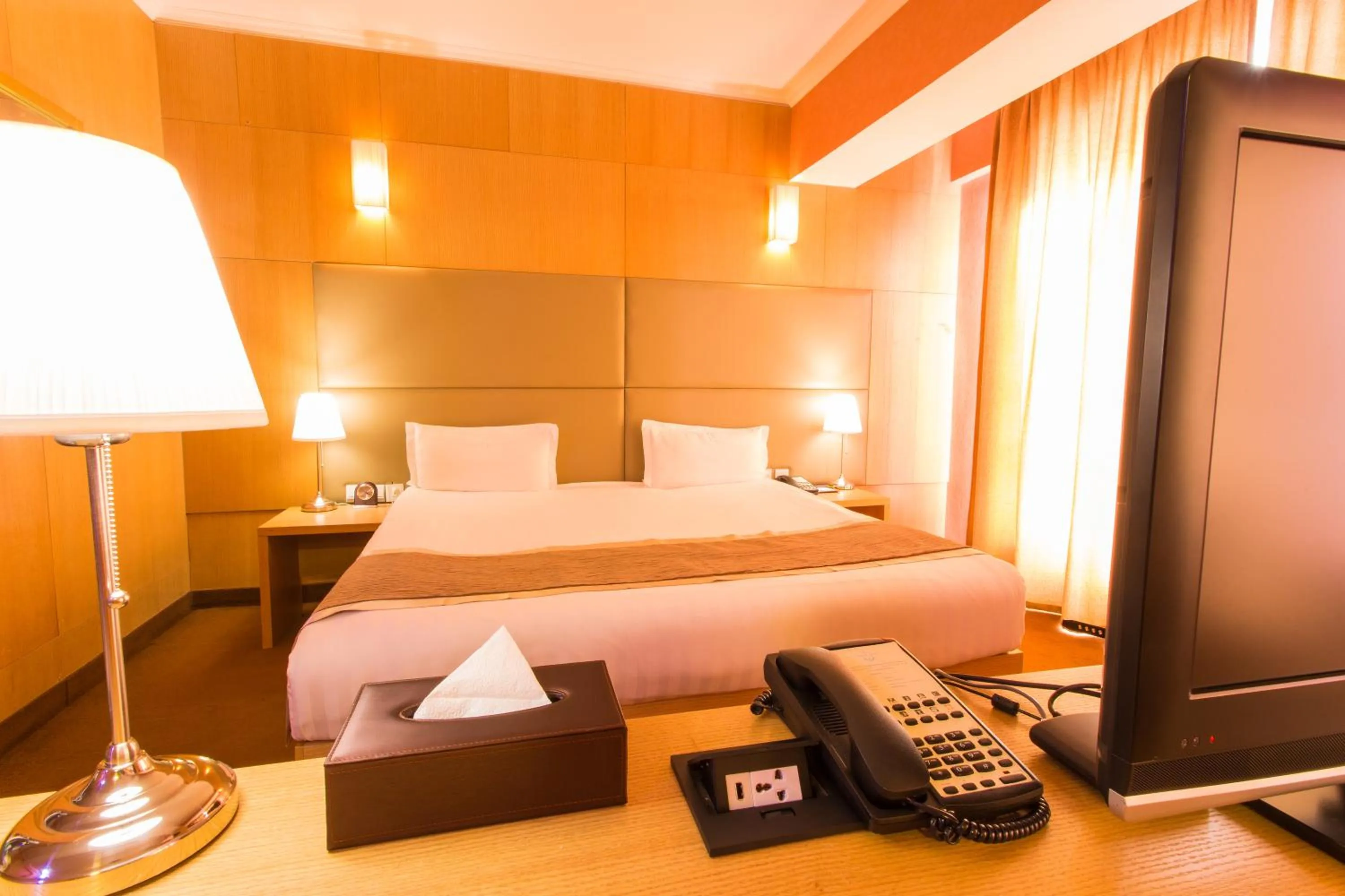 Bed in The Corporate Hotel