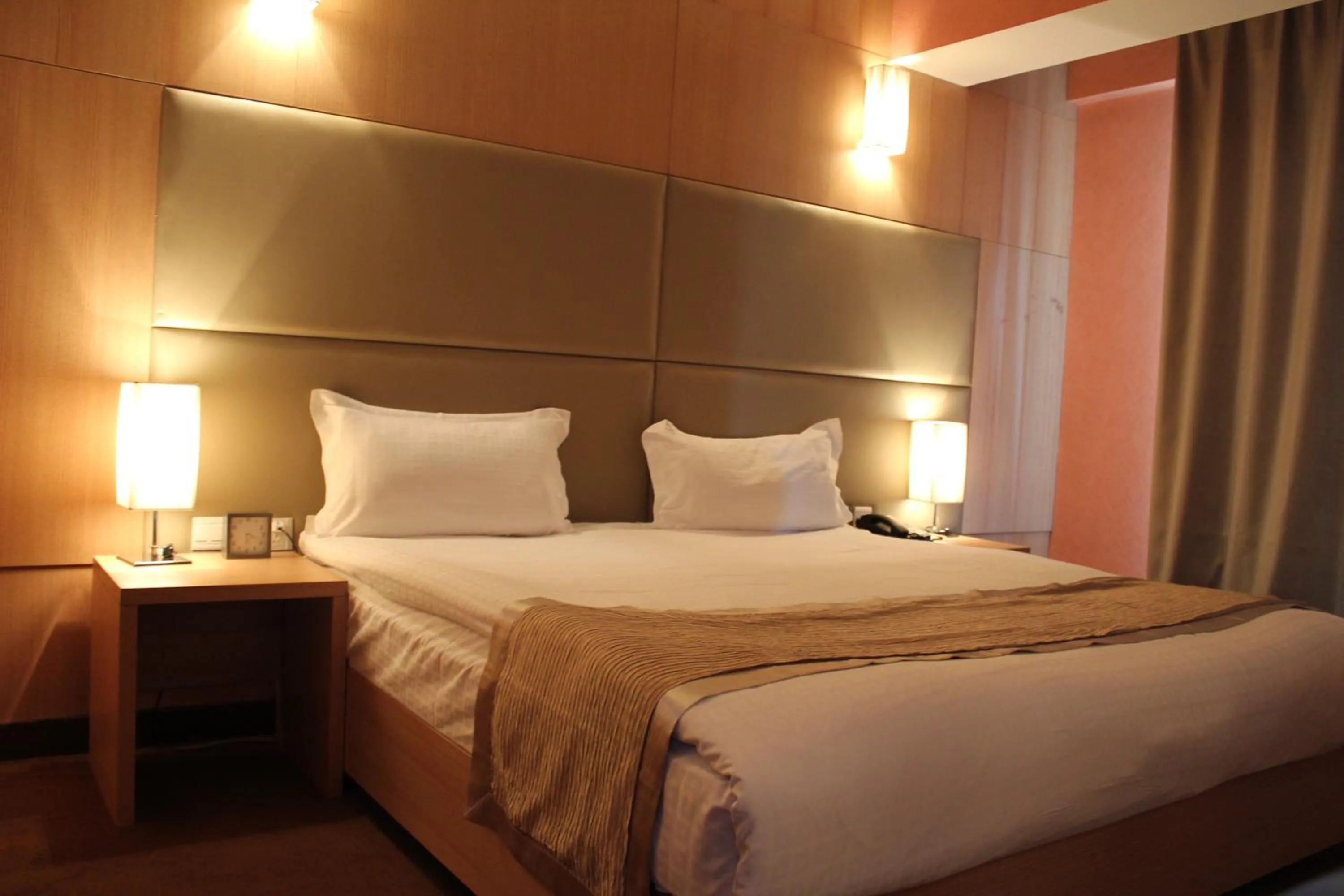 Bed in The Corporate Hotel