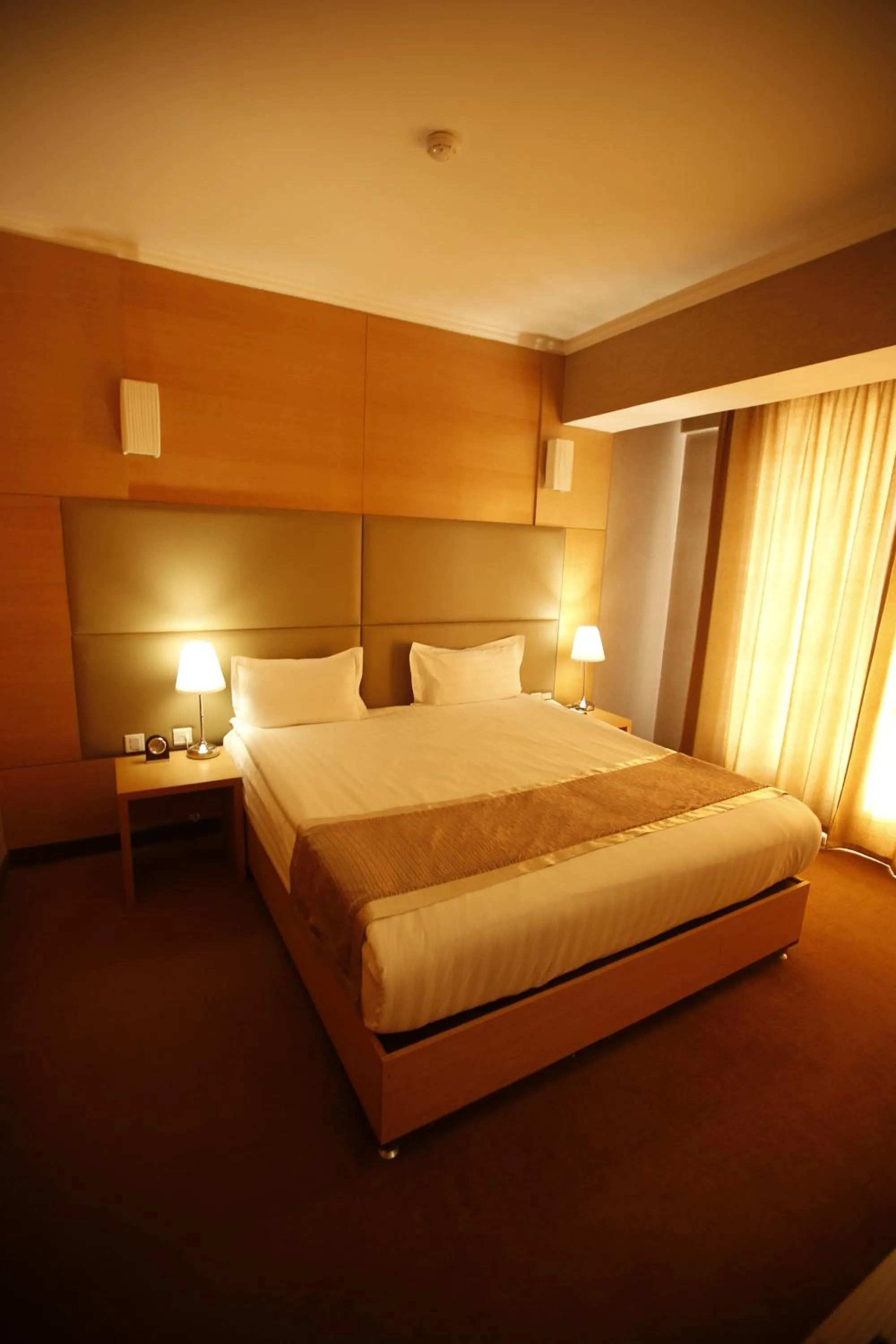 Bed in The Corporate Hotel