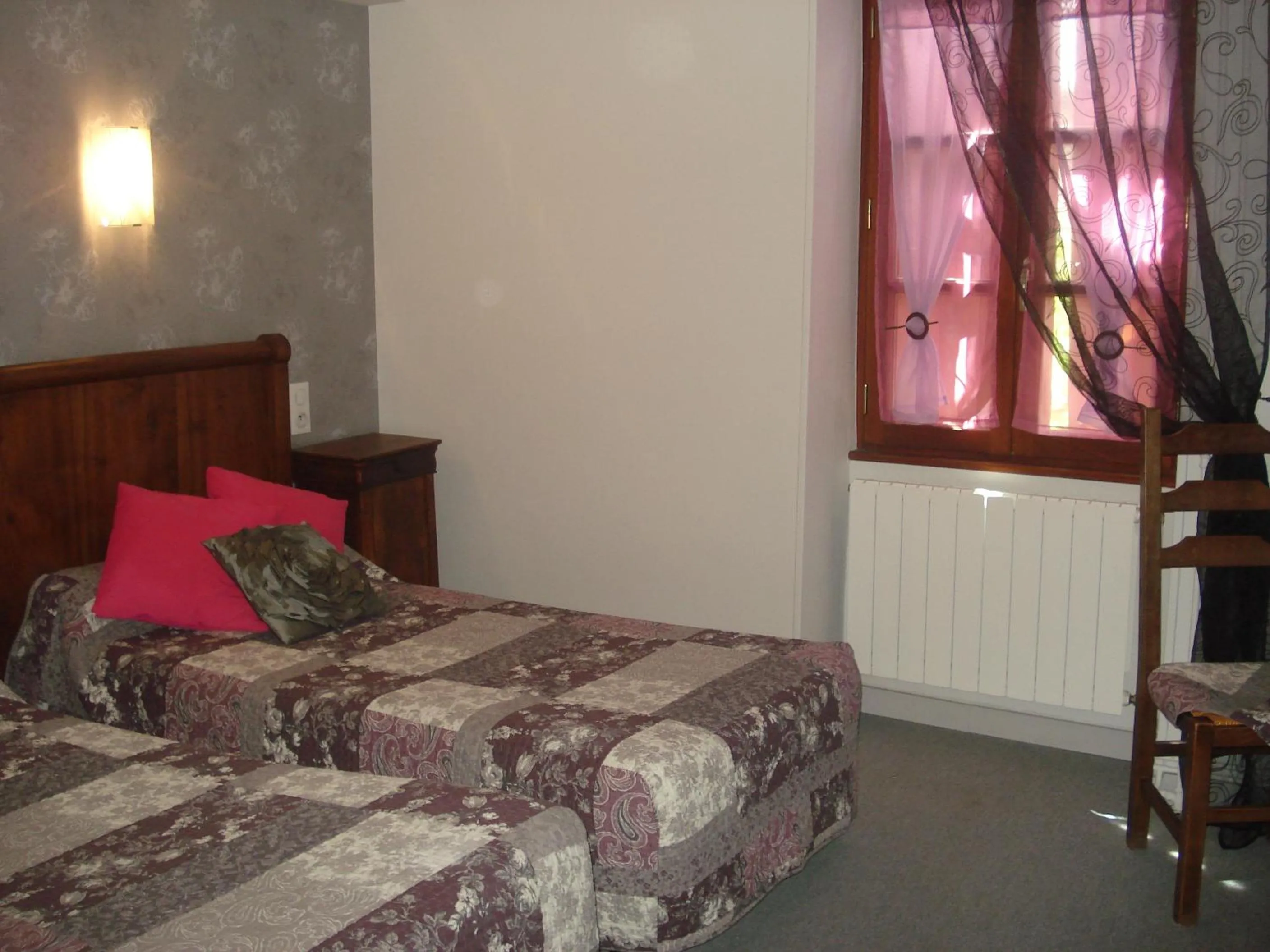 Bed in Auberge Aux Portes de Conques