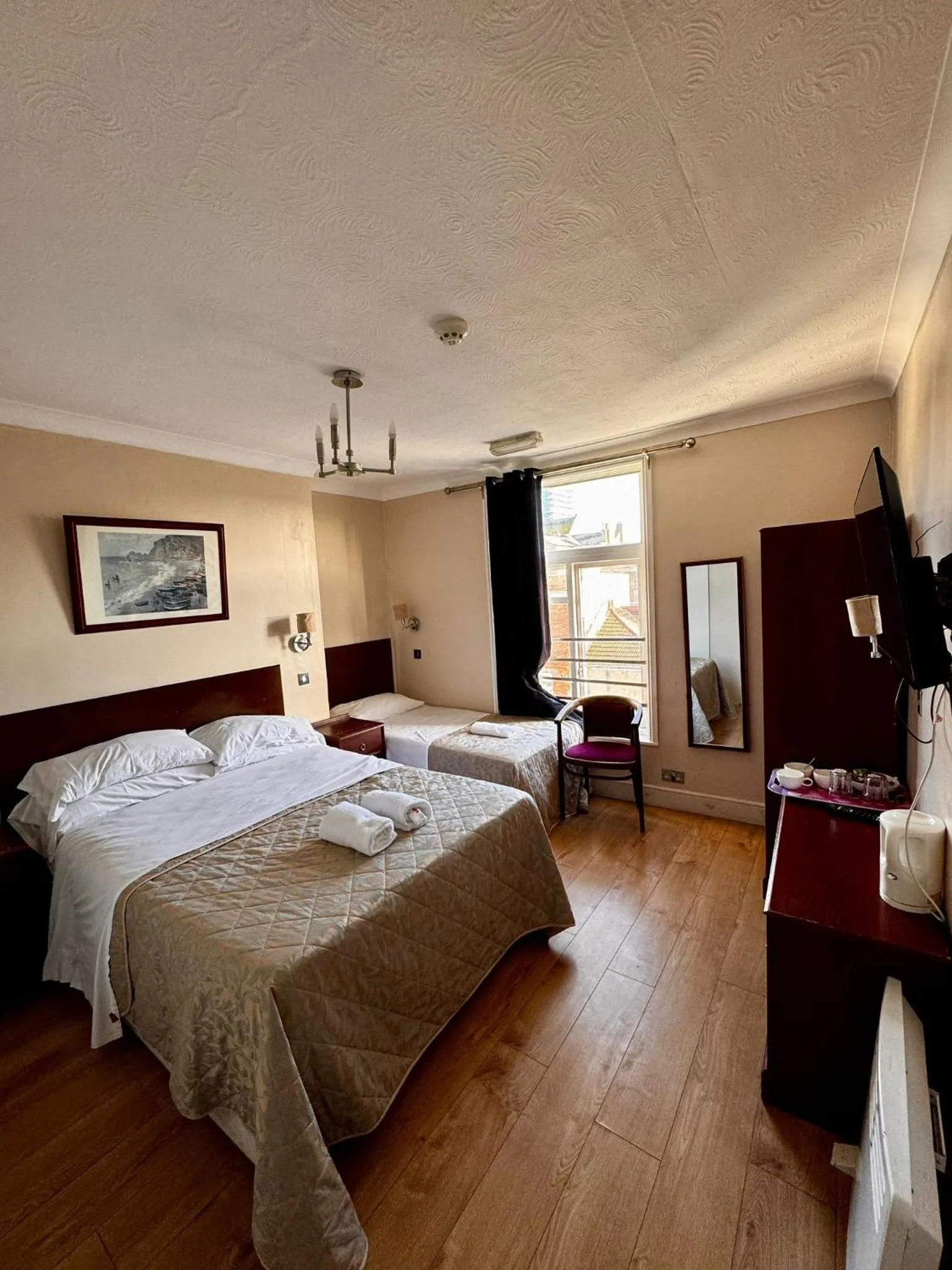 Bed in Ambassador Hotel