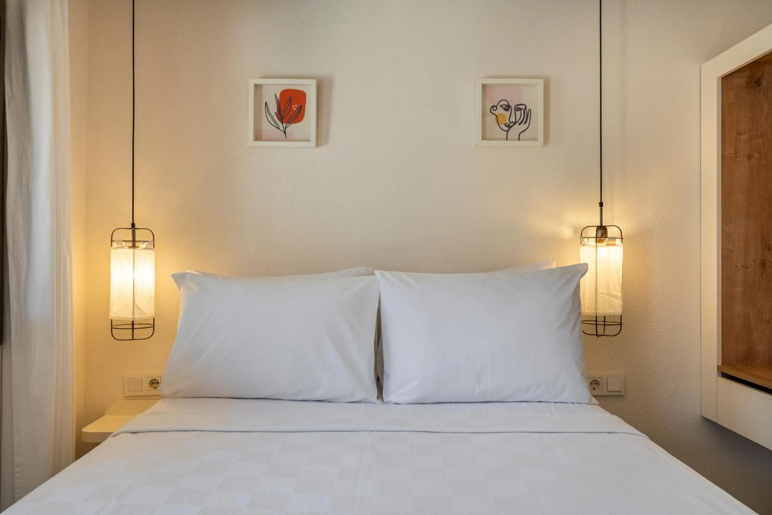Bed in Daphnis Hotel