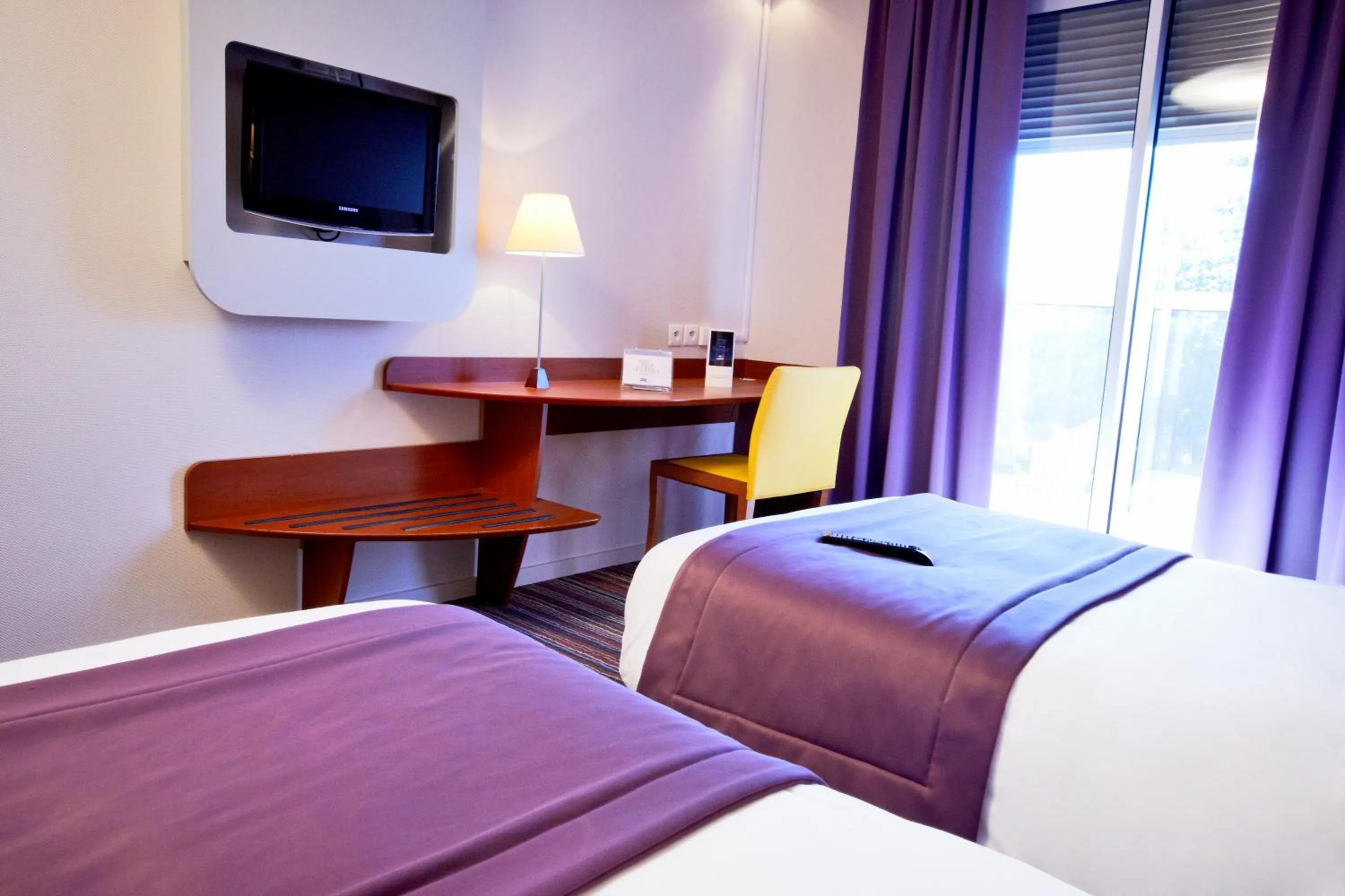 Bedroom, TV/Entertainment Center in Kyriad Bourg En Bresse