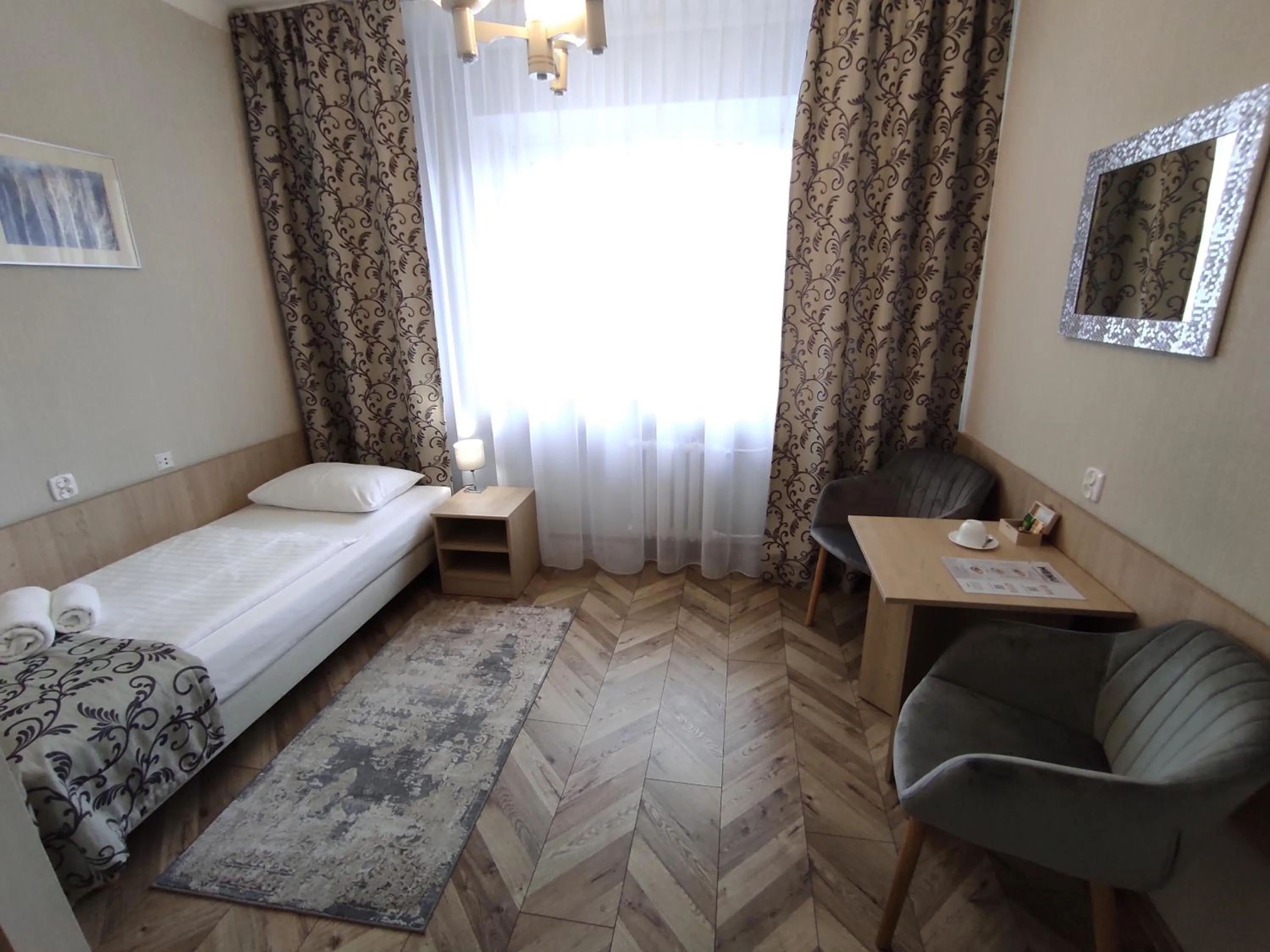 Seating area, Bed in Hotel Polonia