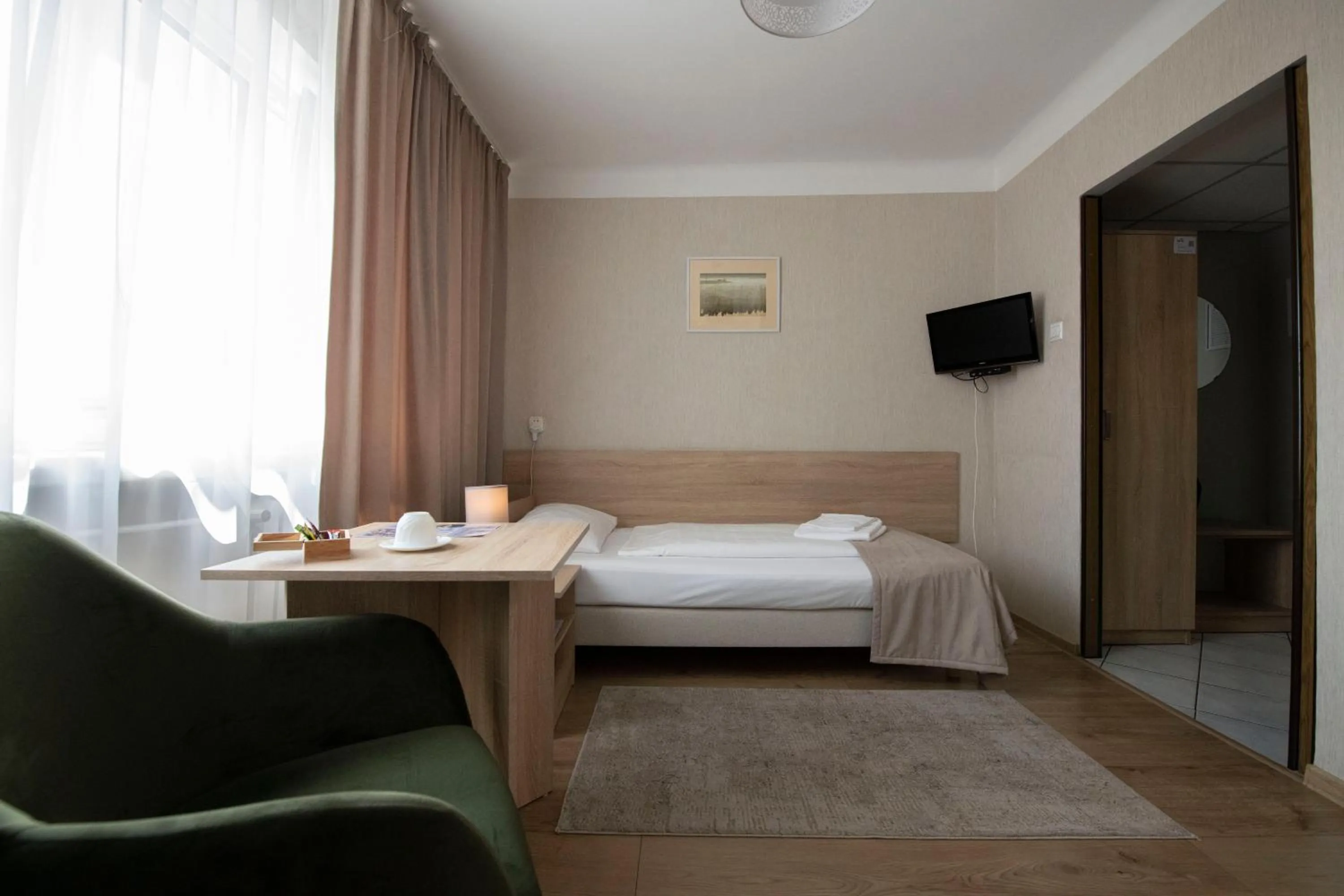 Seating area, Bed in Hotel Polonia