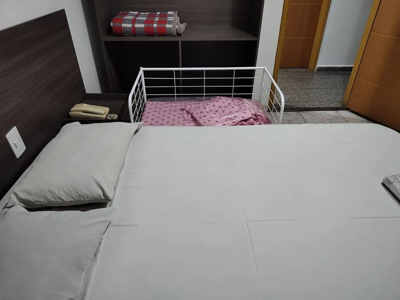 Bed in Center Plaza Hotel