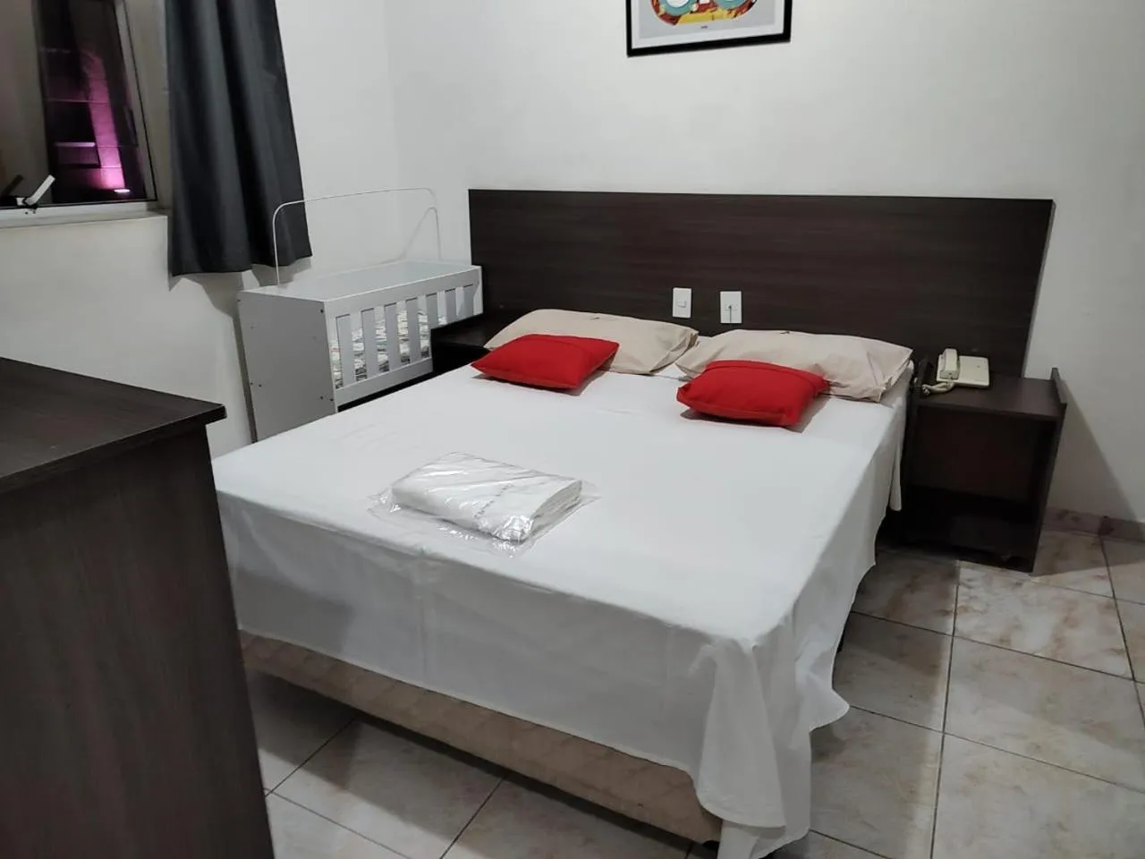 Bed in Center Plaza Hotel