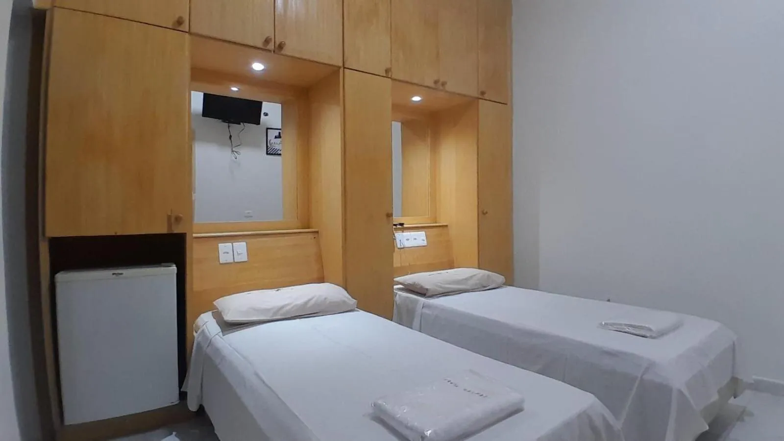 Bed in Center Plaza Hotel