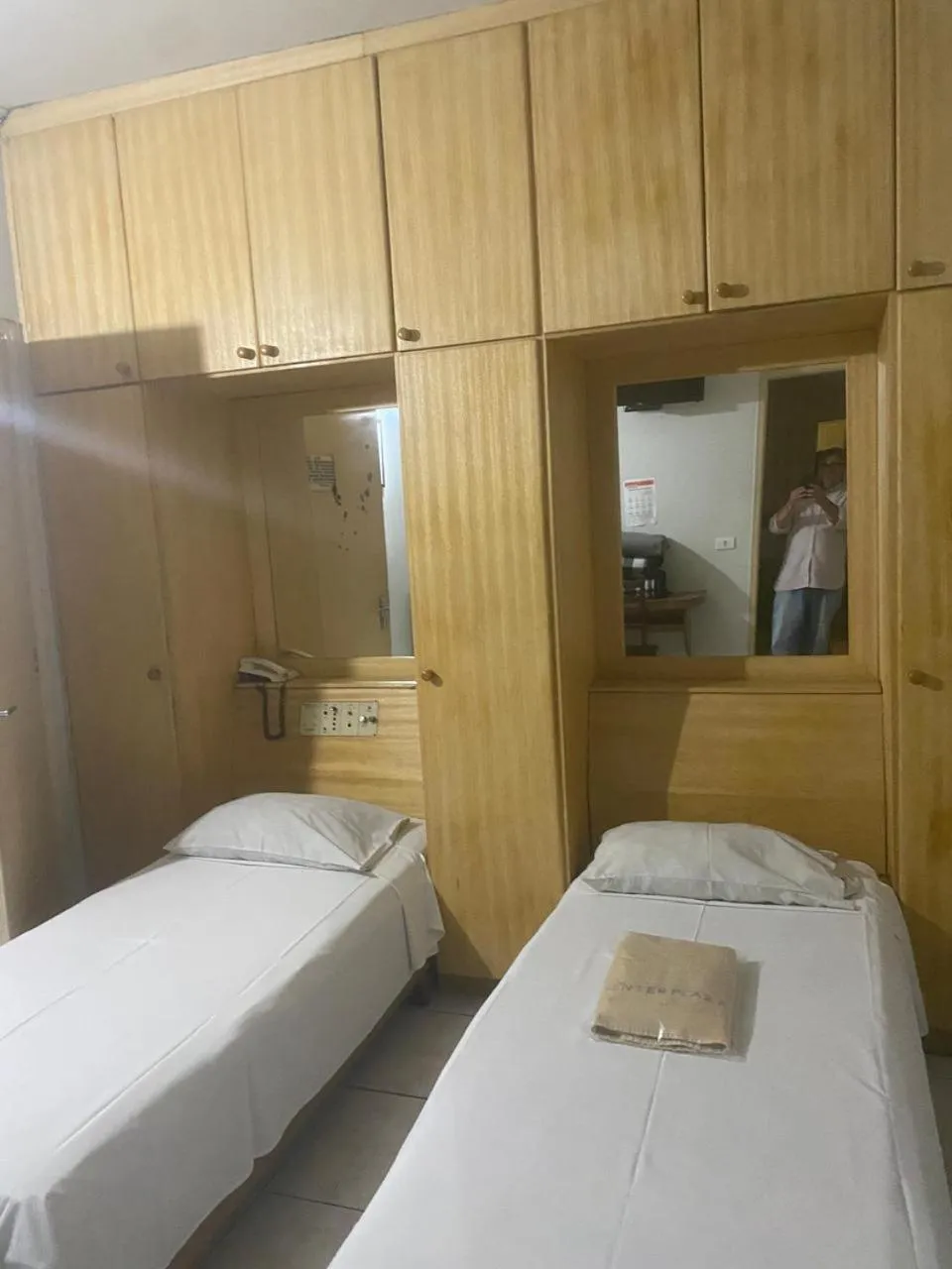 Bed in Center Plaza Hotel