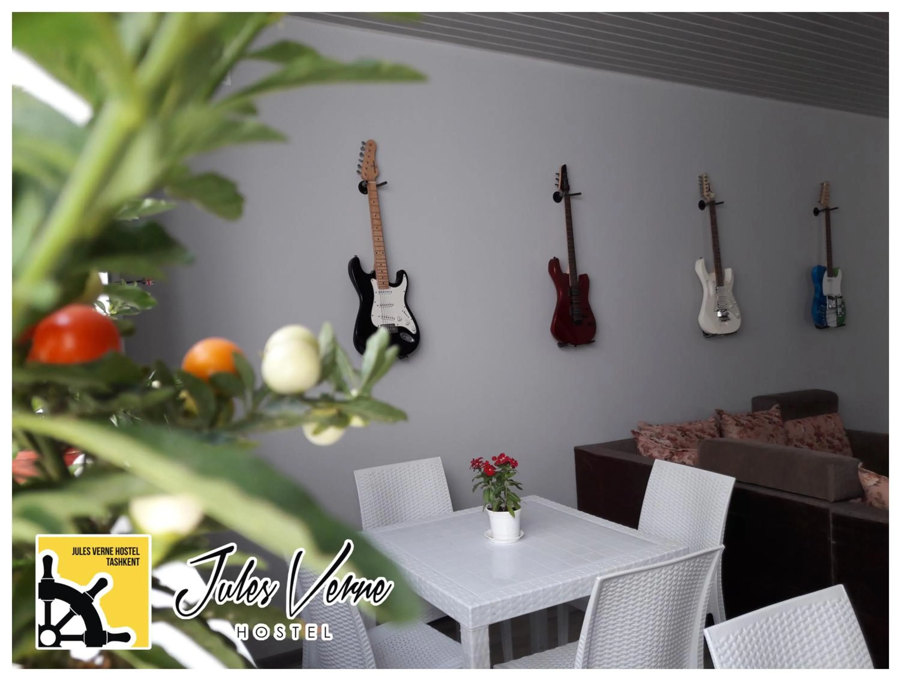 Communal lounge/ TV room in Jules Verne Hostel