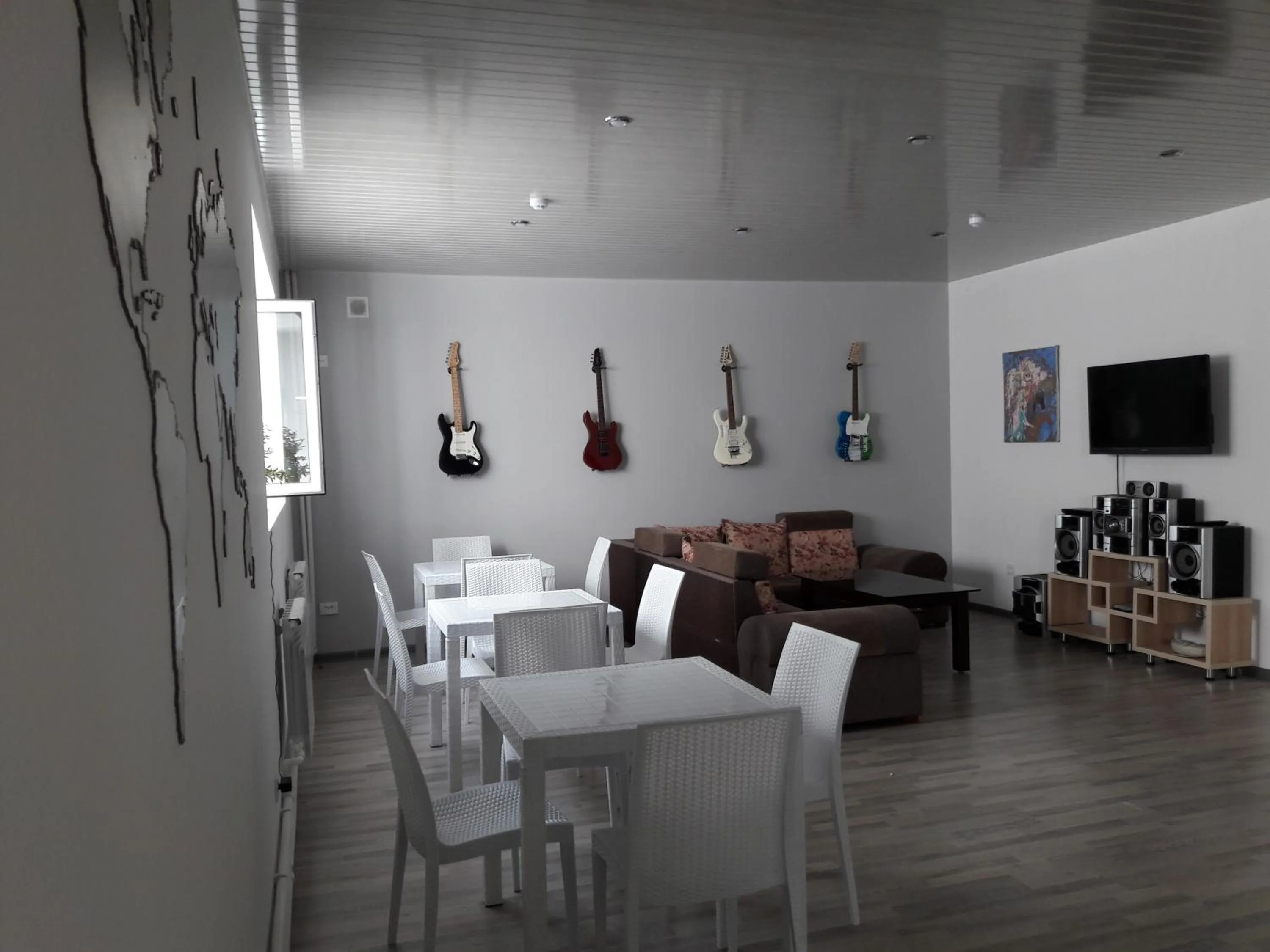 Communal lounge/ TV room in Jules Verne Hostel