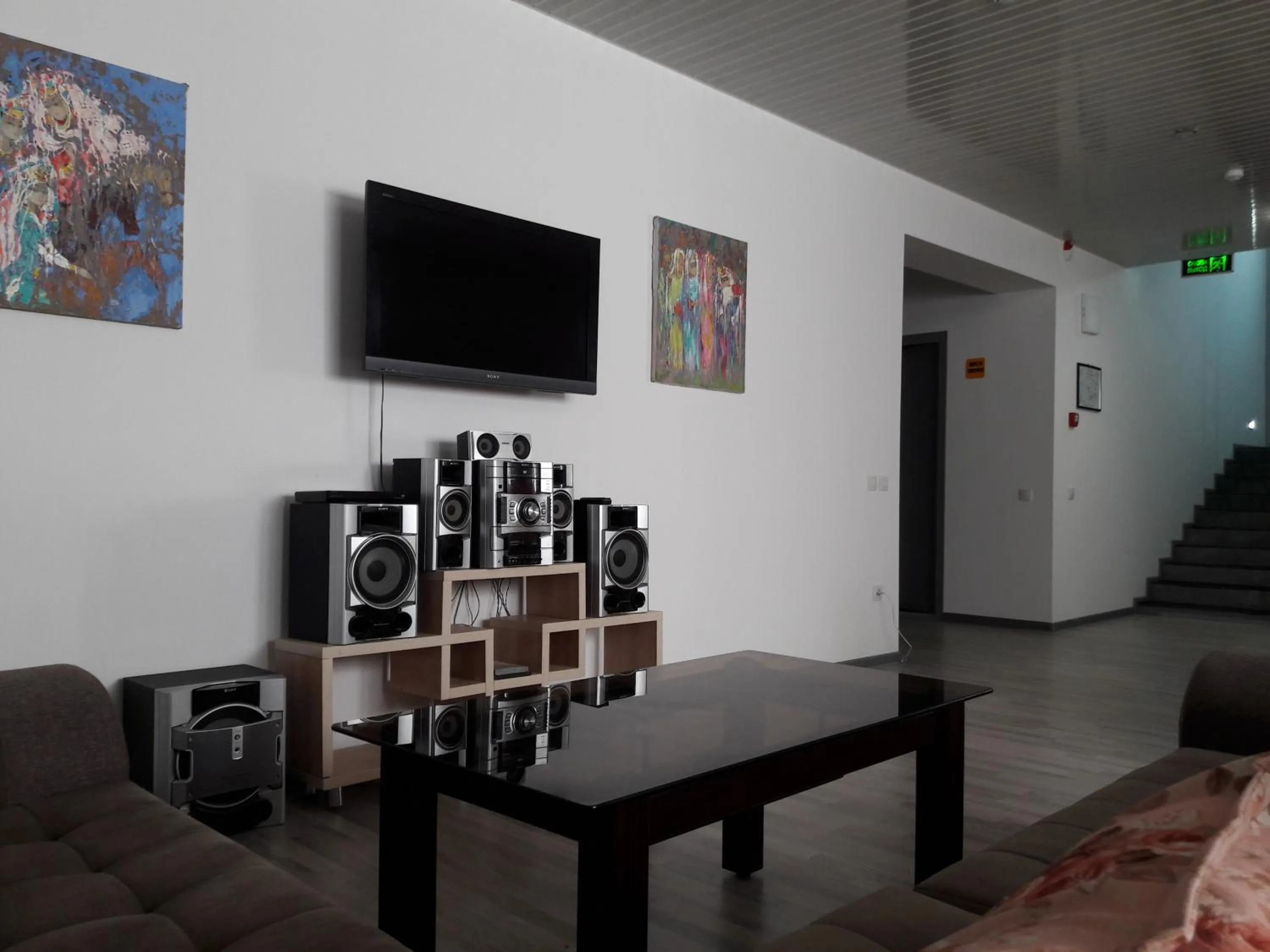 Communal lounge/ TV room in Jules Verne Hostel