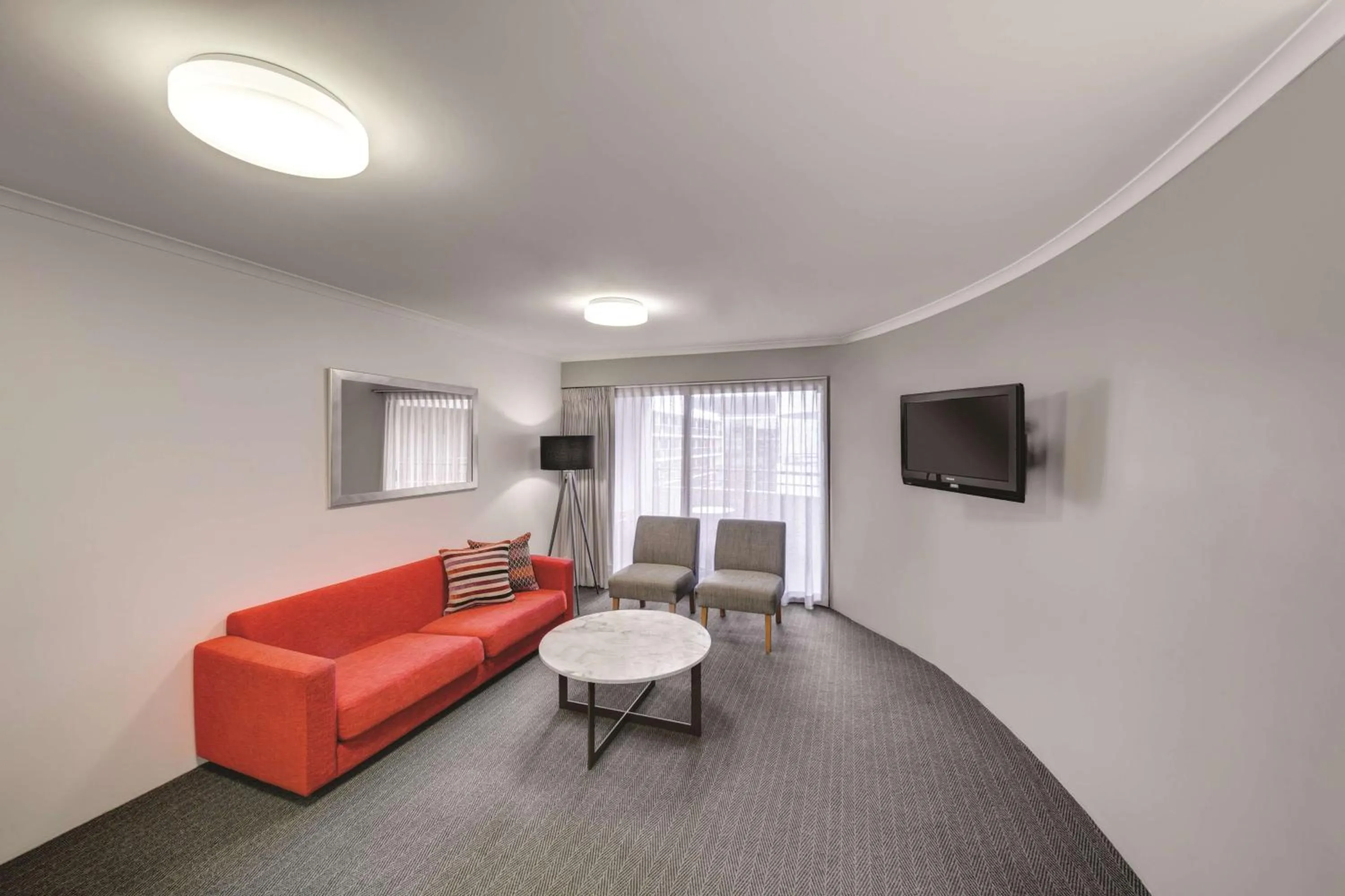 Living room in Adina Serviced Apartments Canberra James Court