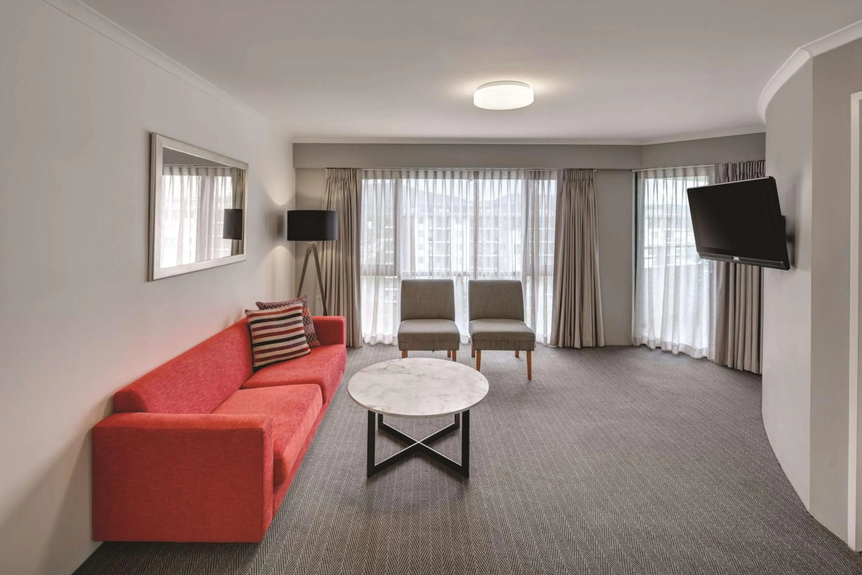 TV and multimedia in Adina Serviced Apartments Canberra James Court