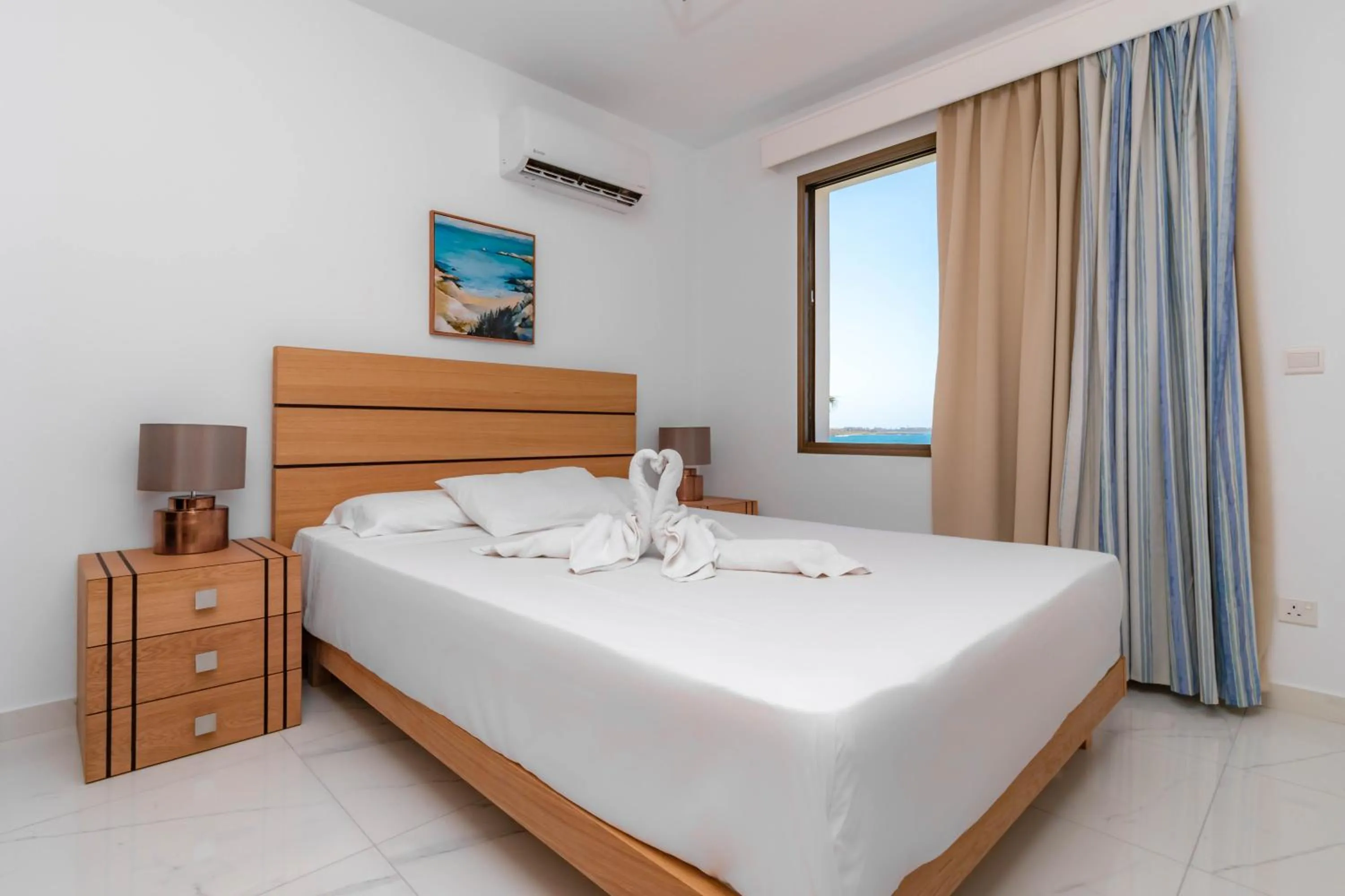 Bed in Rododafni Beach Apartments