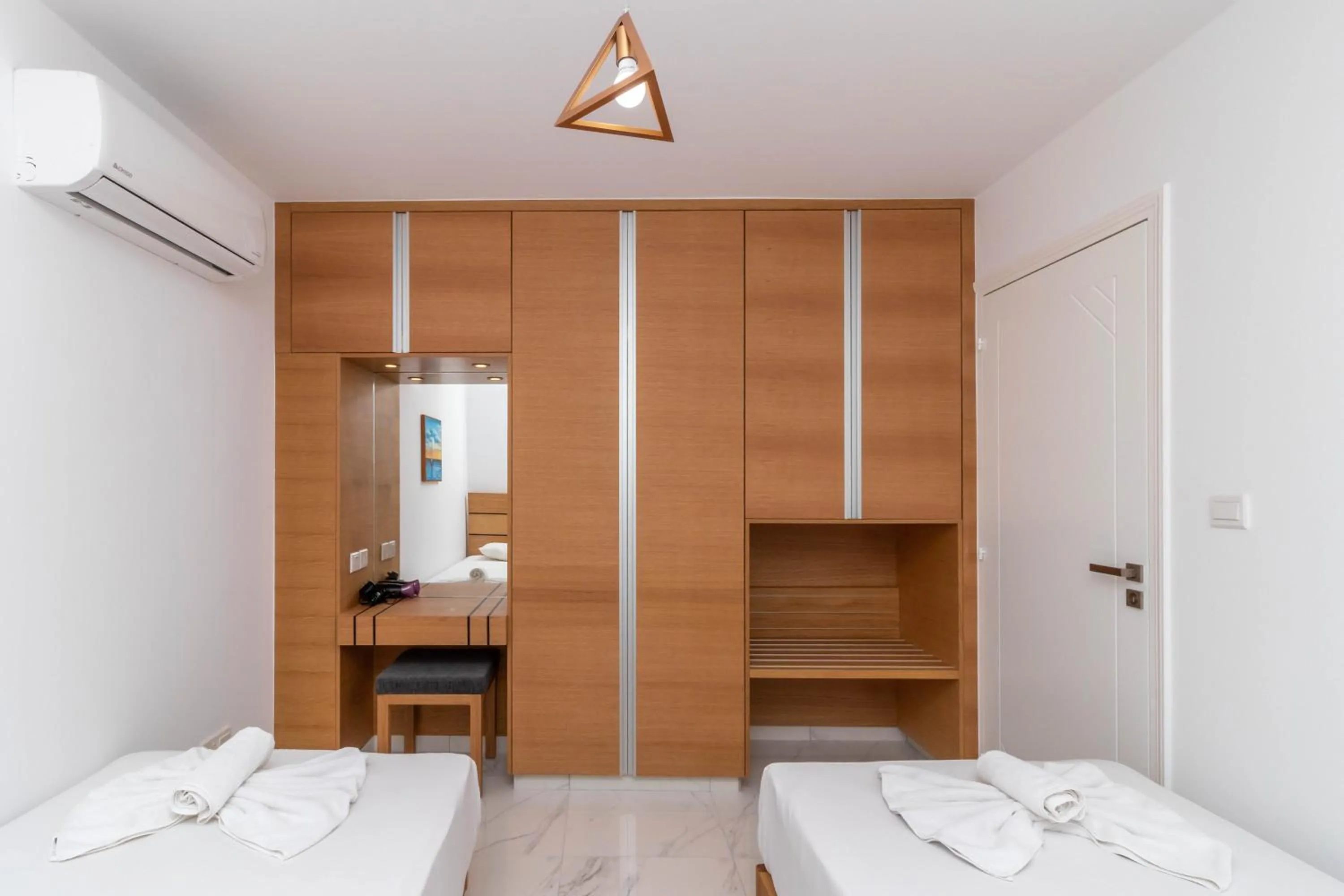 Bed in Rododafni Beach Apartments