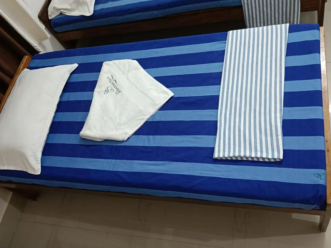 Bed in Hotel Jebasakthy
