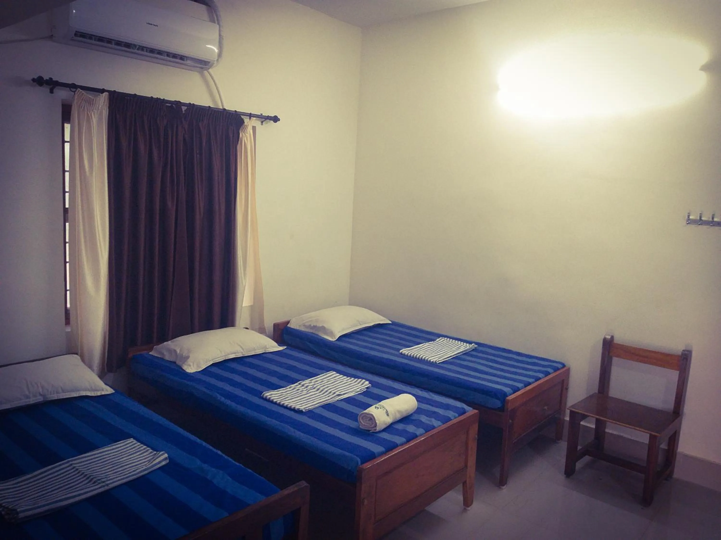 Bed in Hotel Jebasakthy