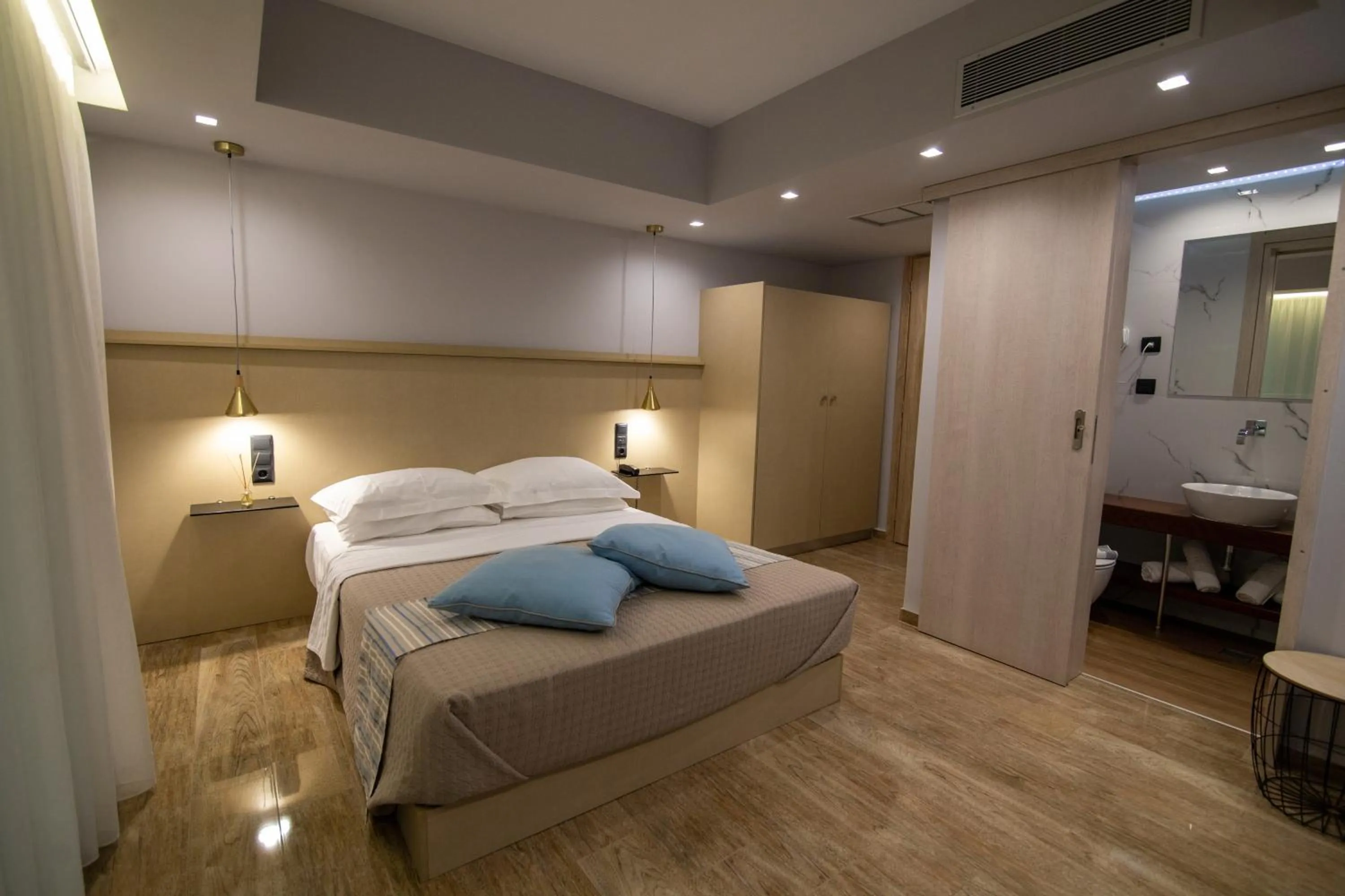 Bed in Aianteion Bay Luxury Hotel & Suites