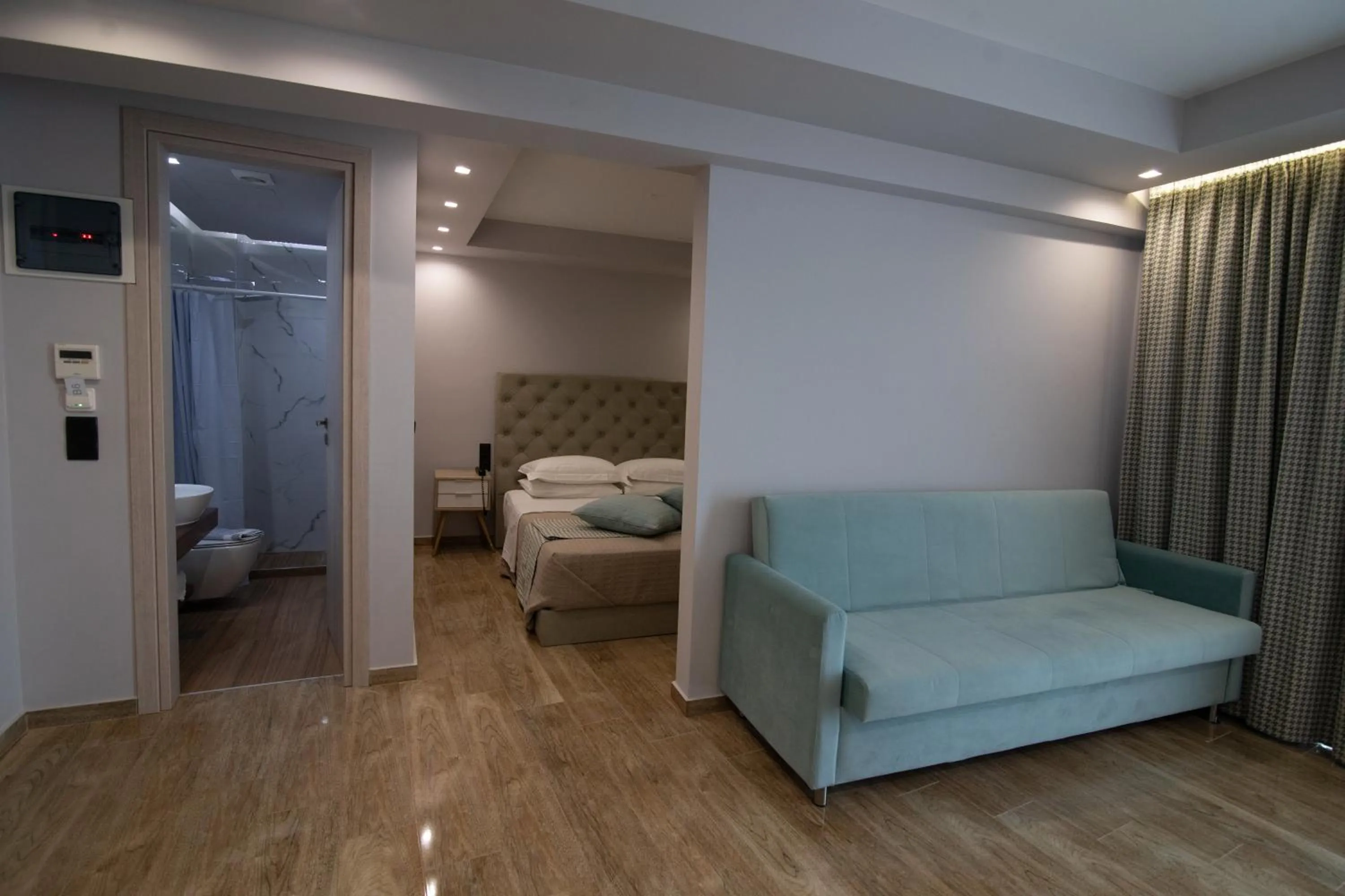 Bed in Aianteion Bay Luxury Hotel & Suites