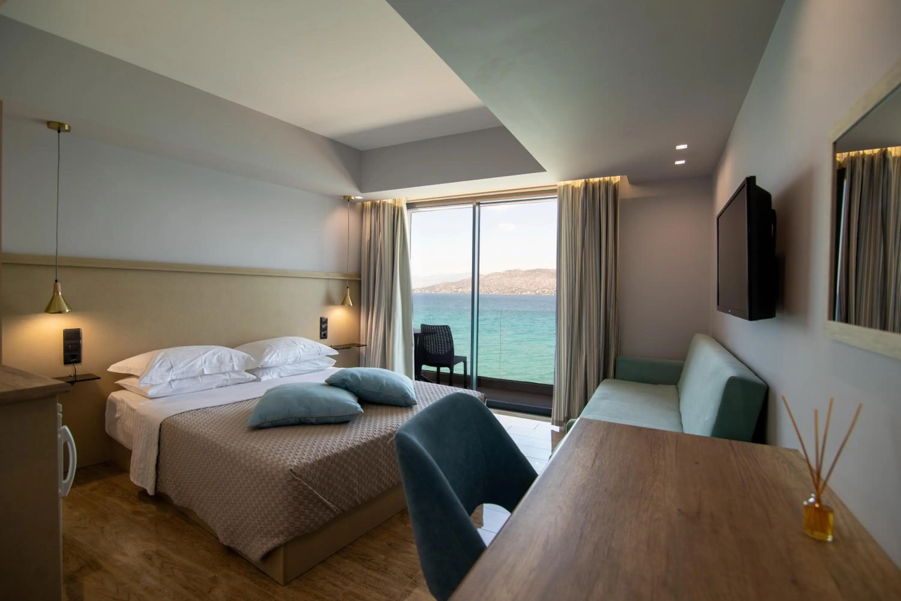 Bed in Aianteion Bay Luxury Hotel & Suites