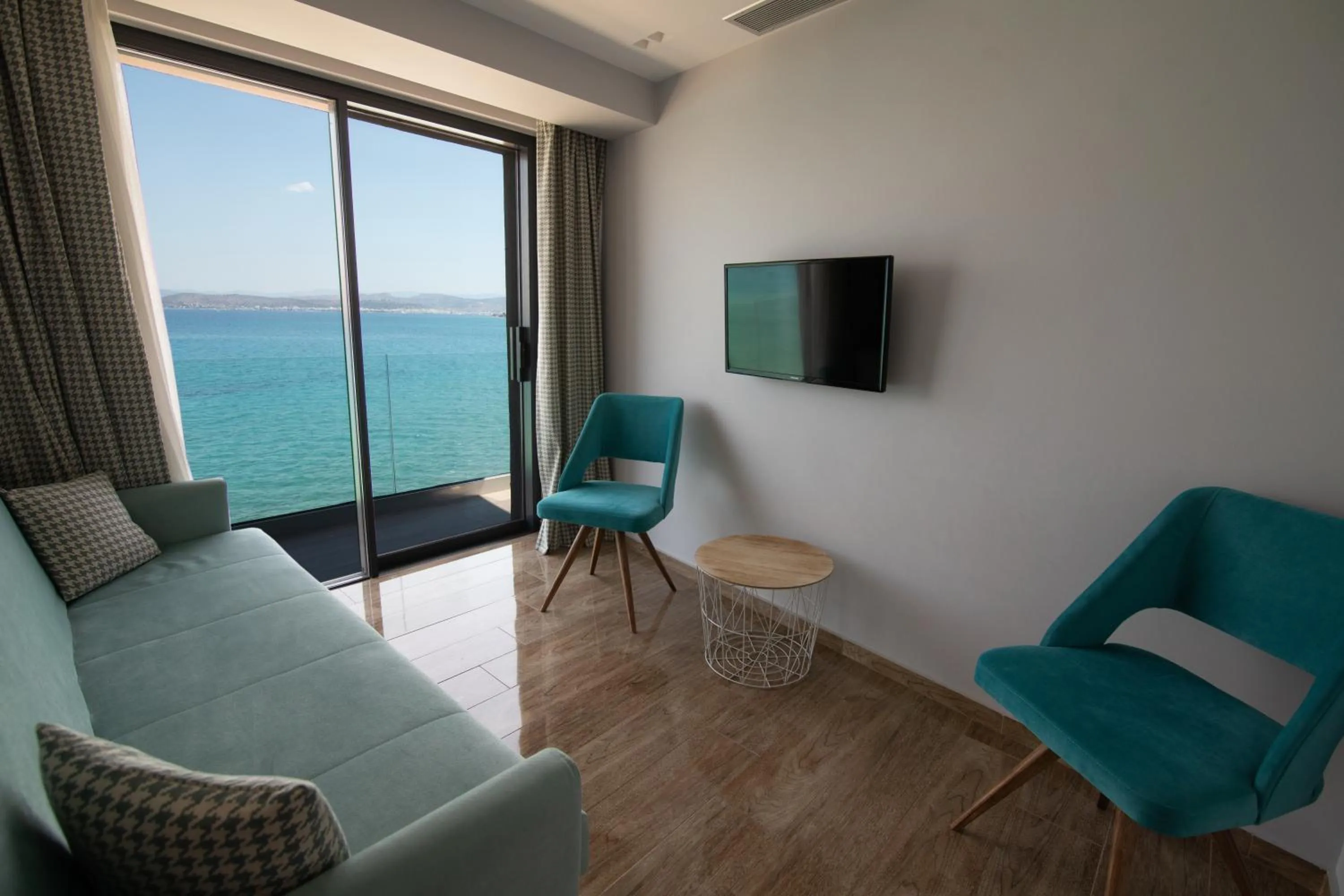 Bed in Aianteion Bay Luxury Hotel & Suites