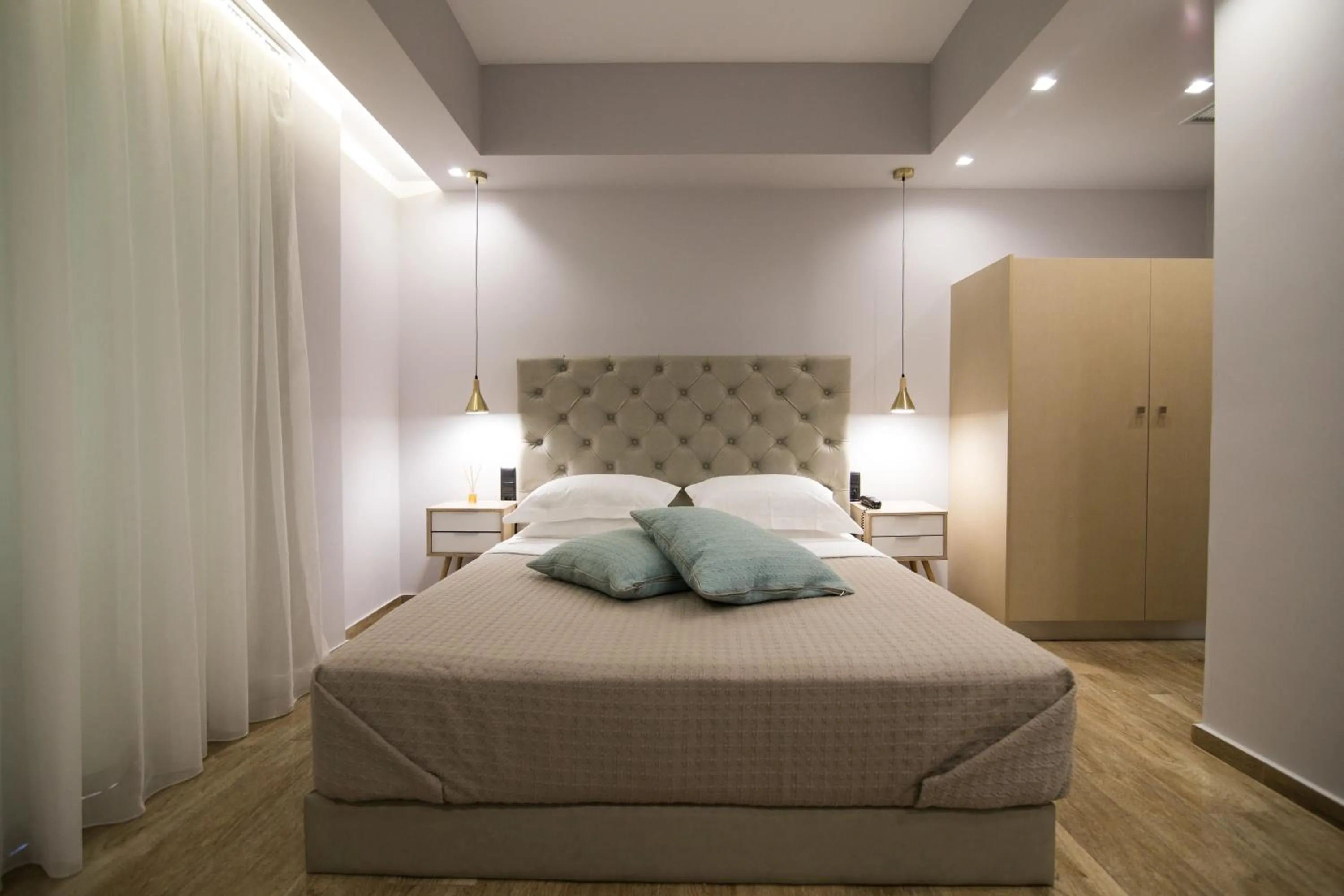 Bed in Aianteion Bay Luxury Hotel & Suites