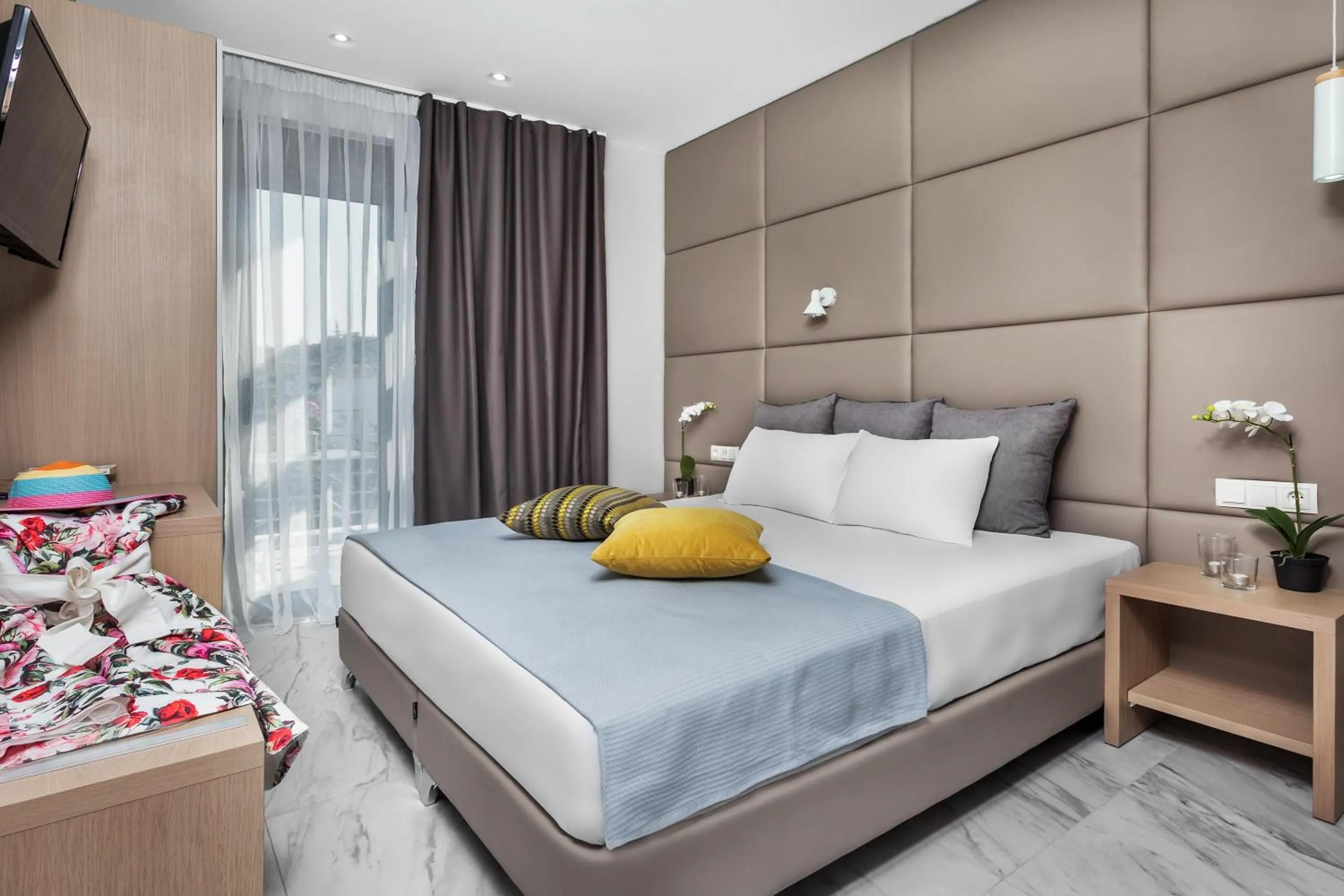 Bed in Nymphes Deluxe Accommodation Pefkochori