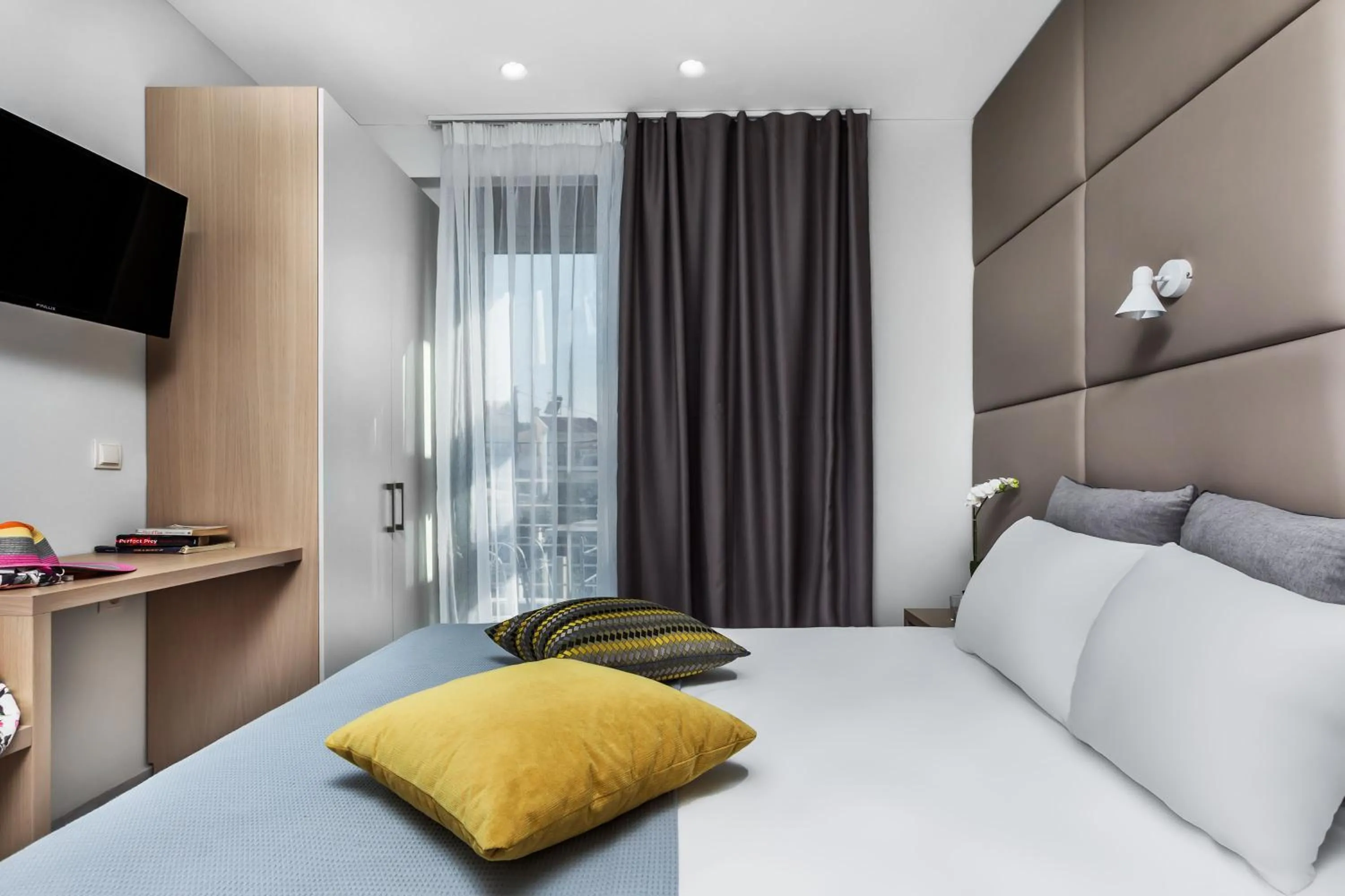 Bed in Nymphes Deluxe Accommodation Pefkochori