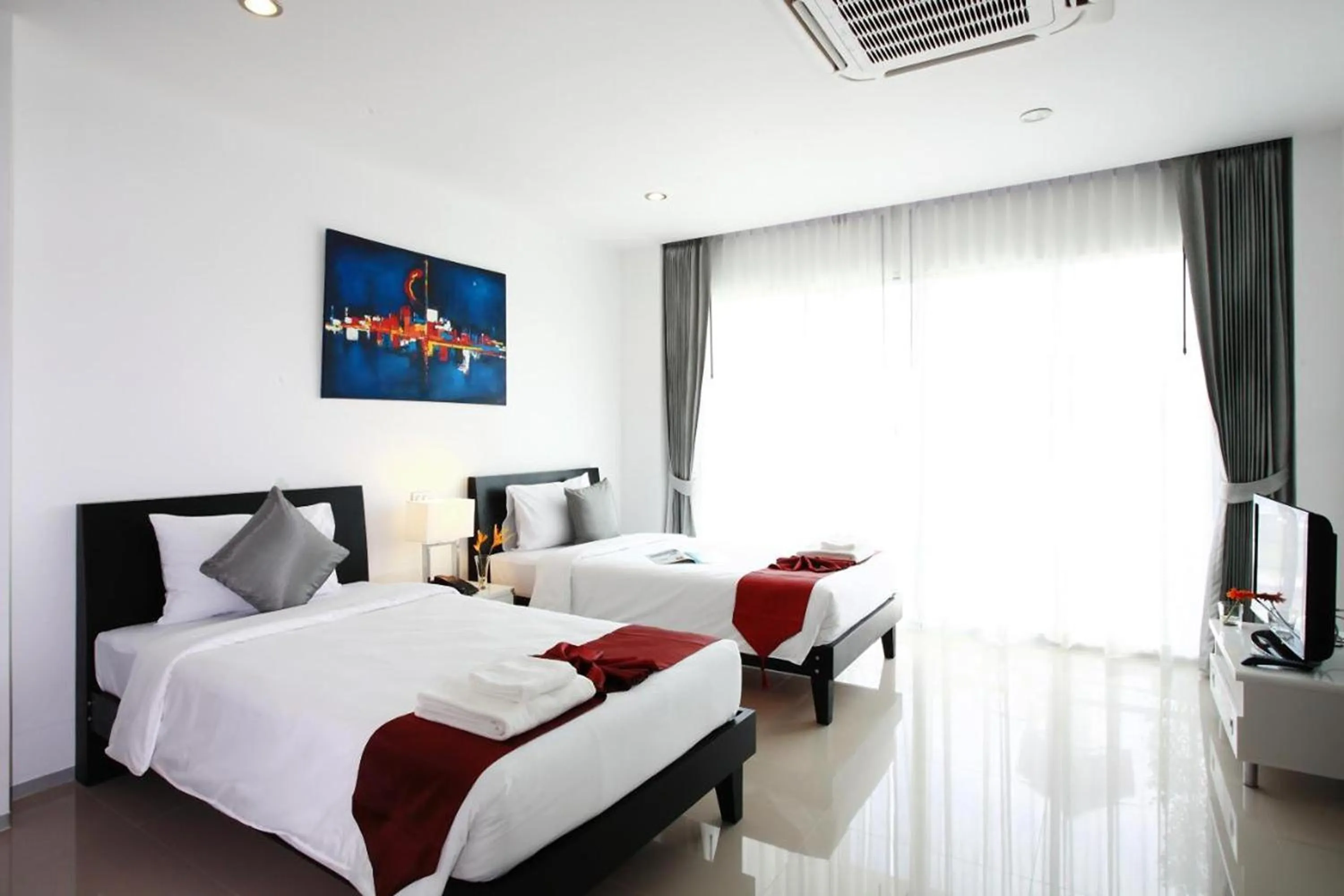 Bed in One World One Home Naiharn Hotel