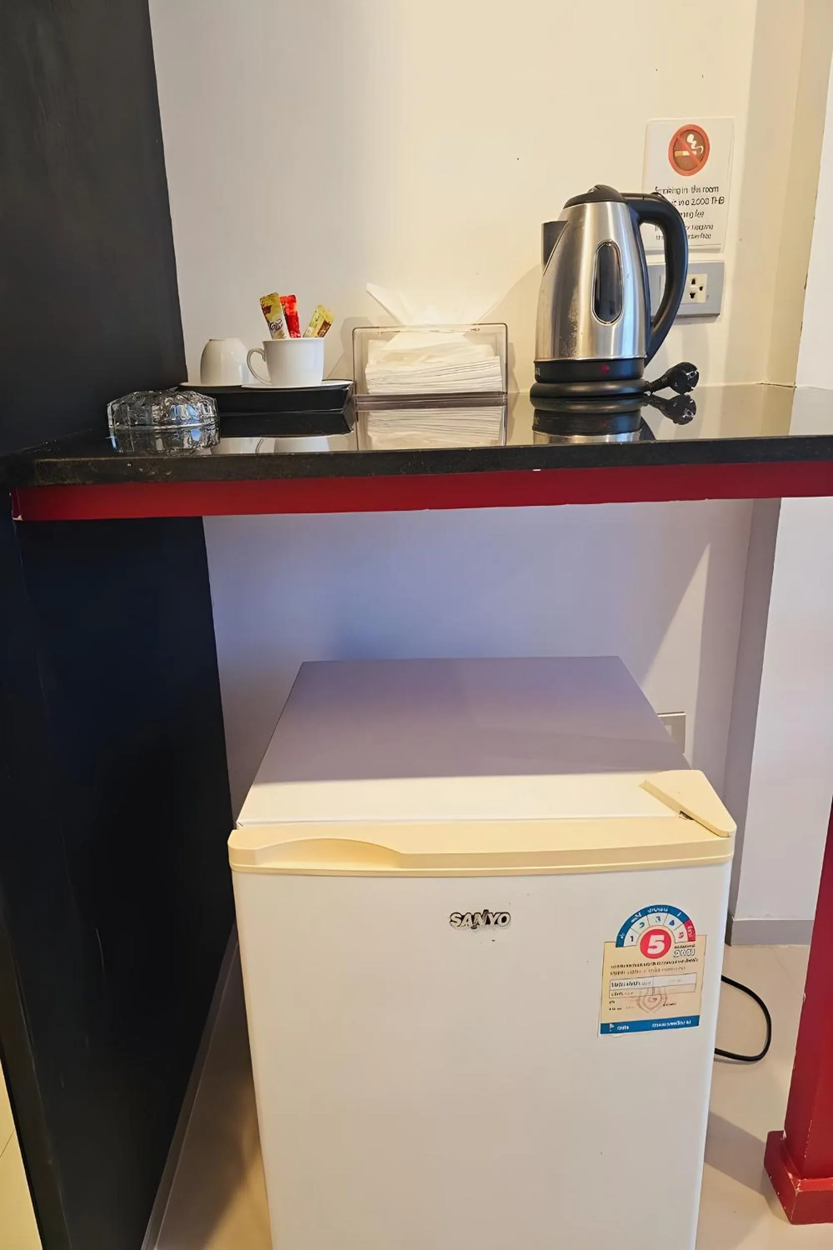 Kitchen or kitchenette in One World One Home Naiharn Hotel