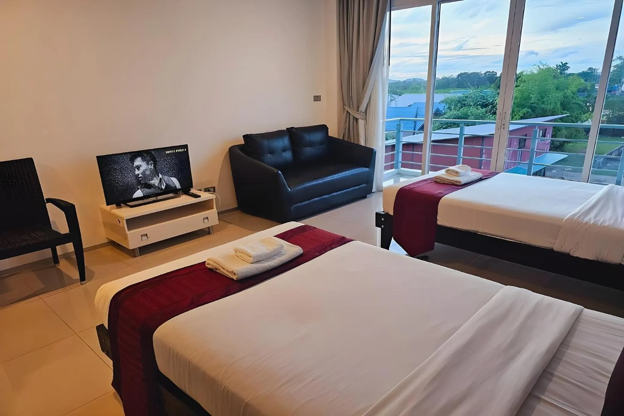 Bed in One World One Home Naiharn Hotel