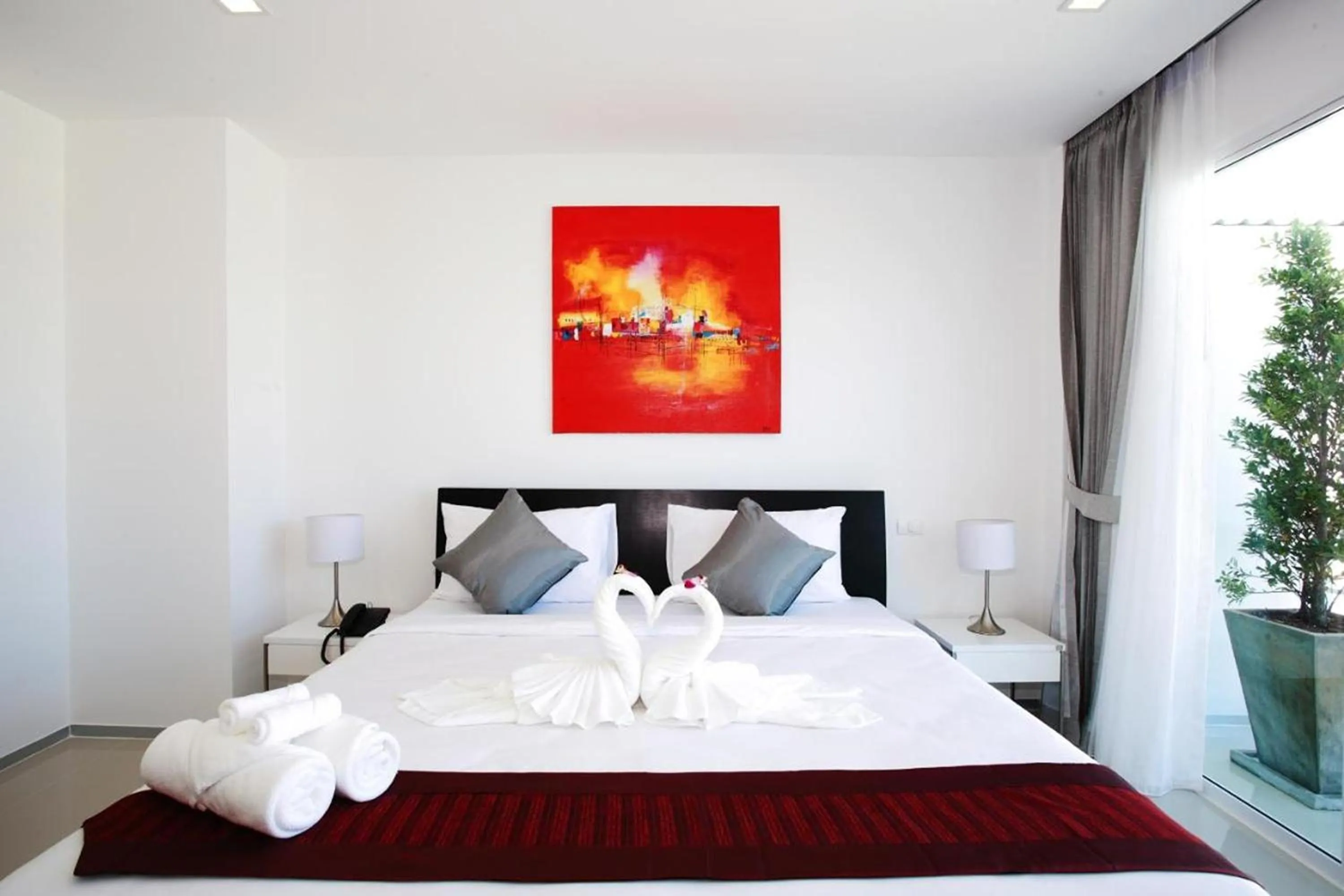 Bed in One World One Home Naiharn Hotel