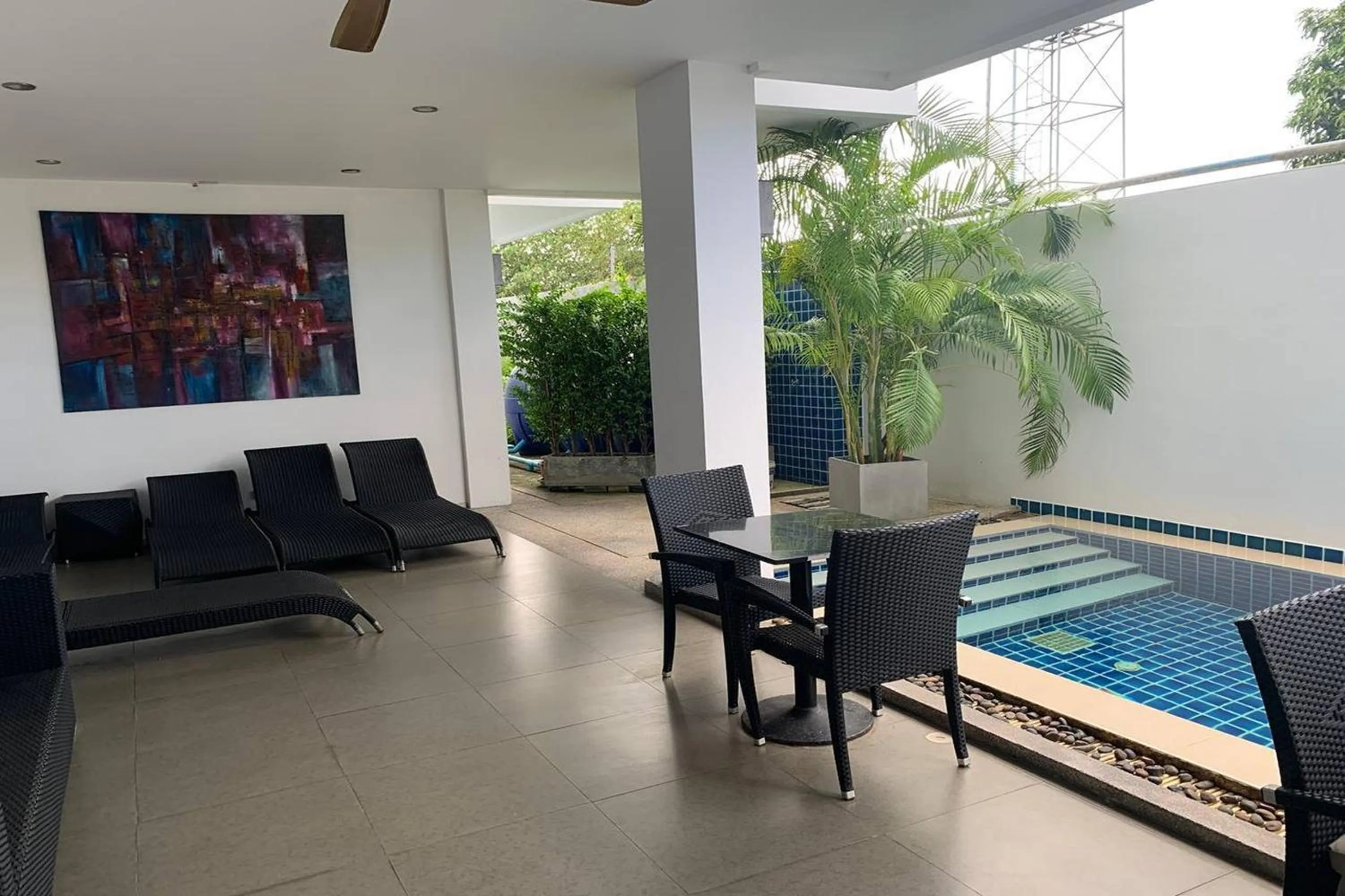 Living room in One World One Home Naiharn Hotel