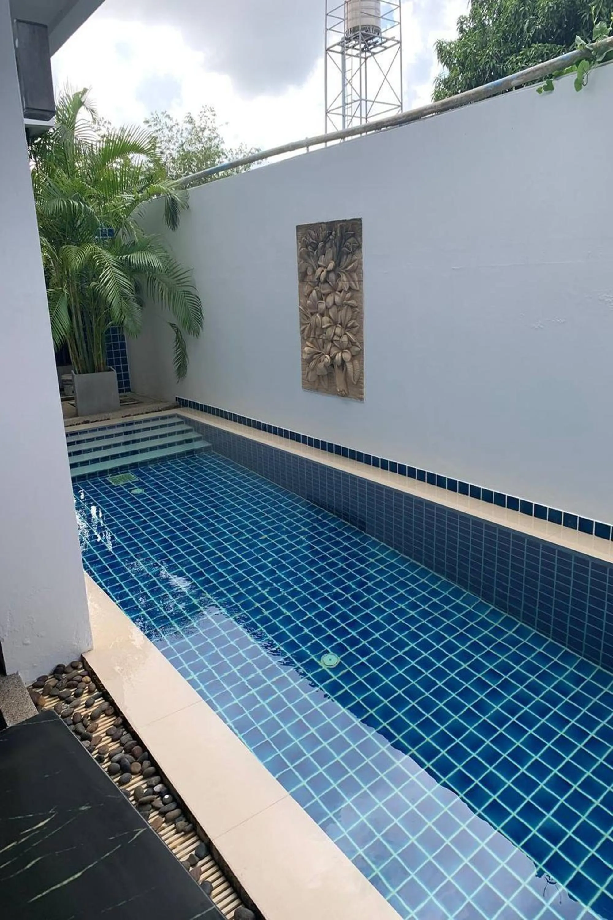 Pool view in One World One Home Naiharn Hotel