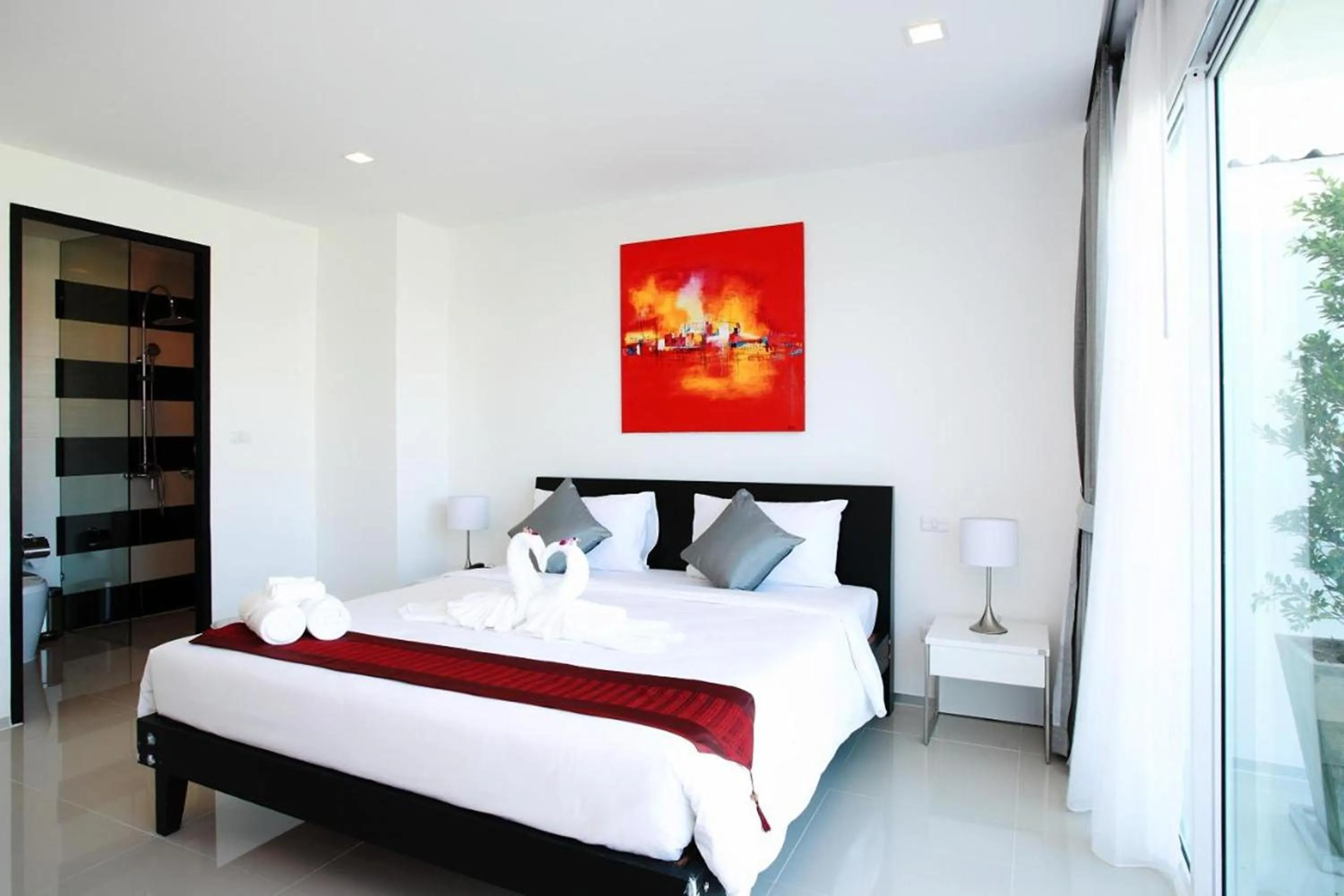 Bed in One World One Home Naiharn Hotel